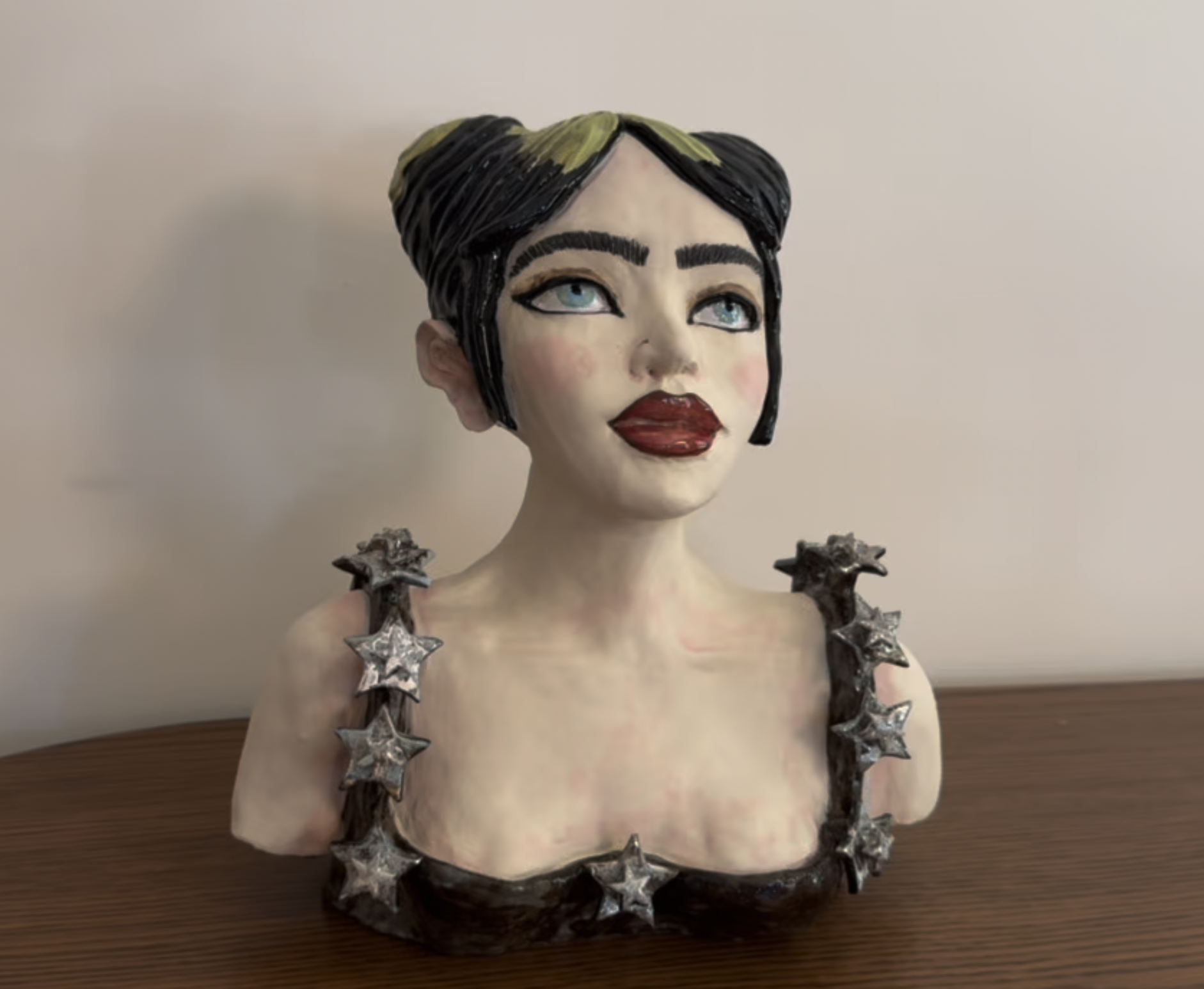 "What was I made for?" A ceramic sculpture of Billie Eilish with chrome stars.