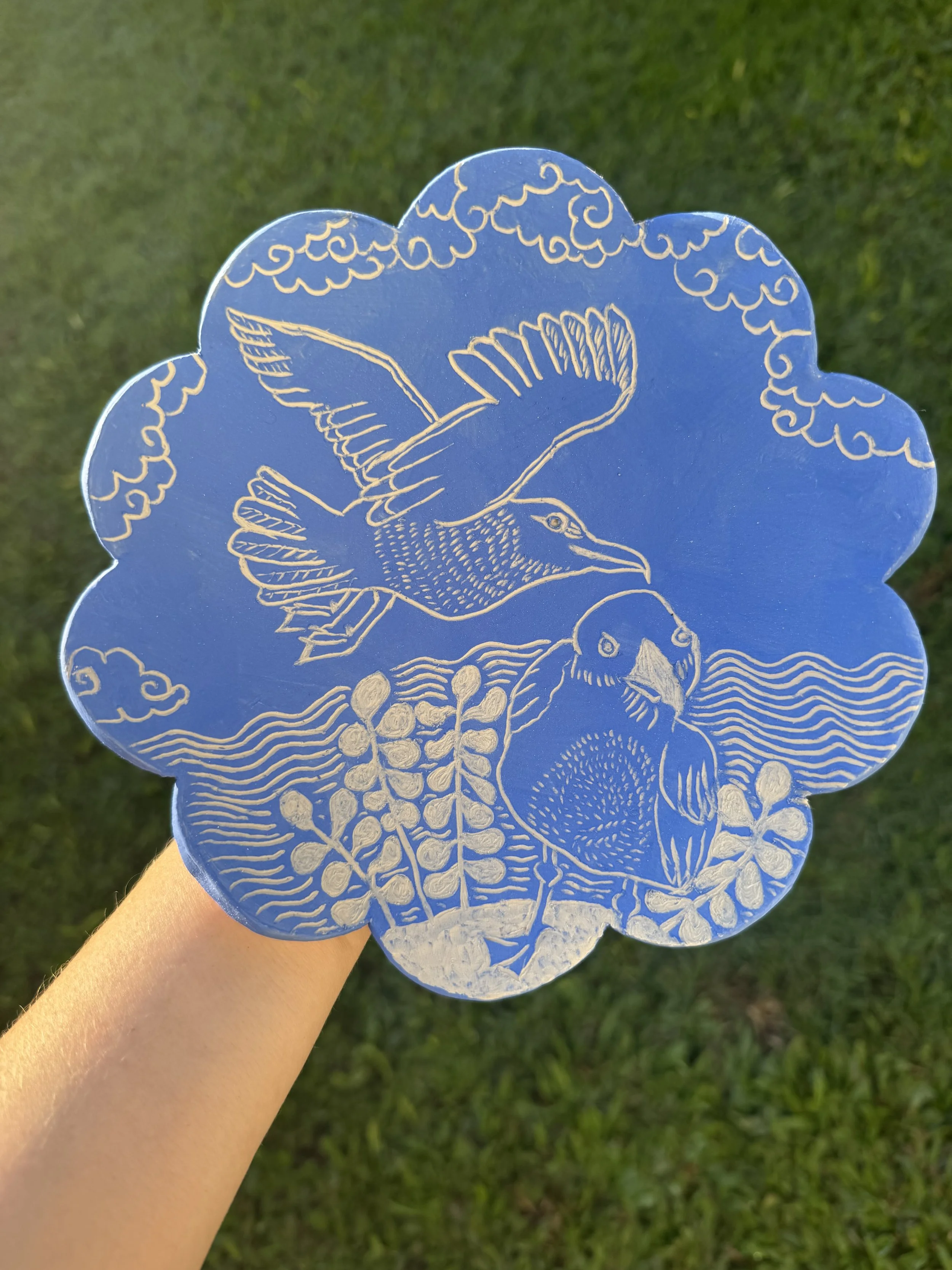 "Freedom and flight". Scalloped ceramic plate with sgraffito illustration of seagulls. 