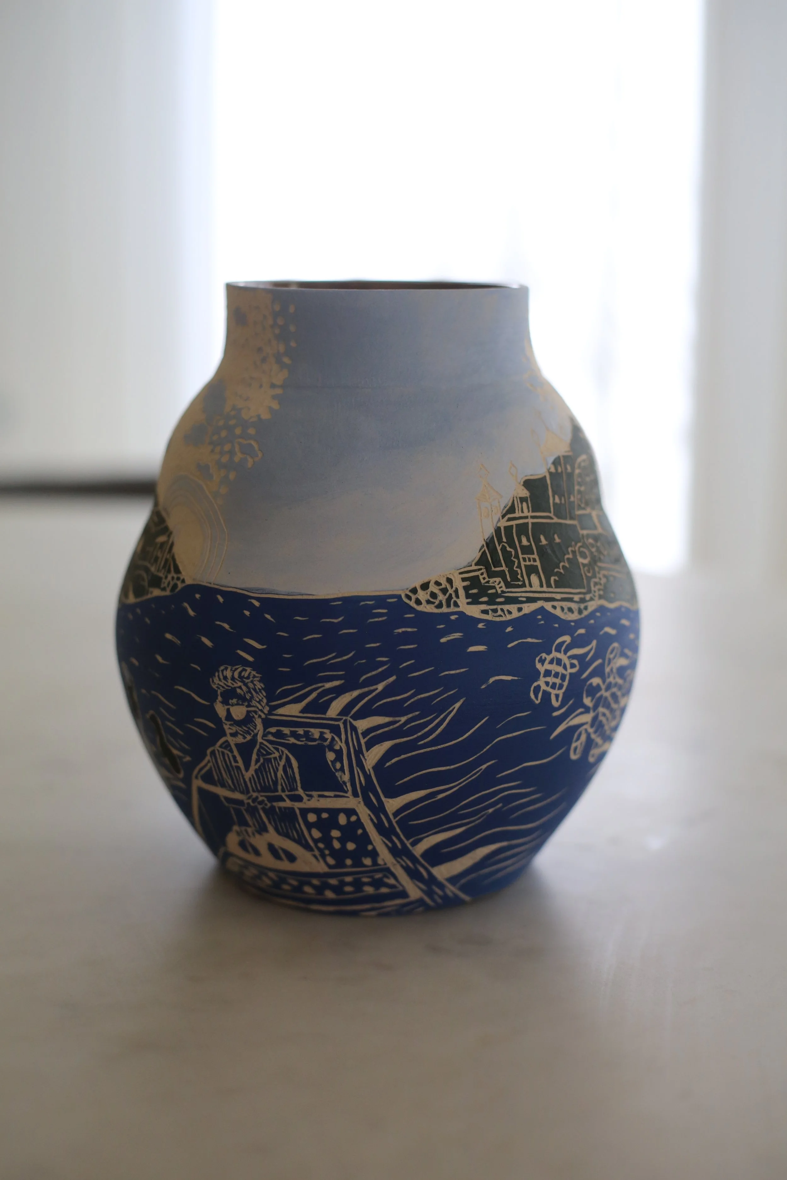 A decorative ceramic vase by Amy Ambrose with a blue and white design - other angle.