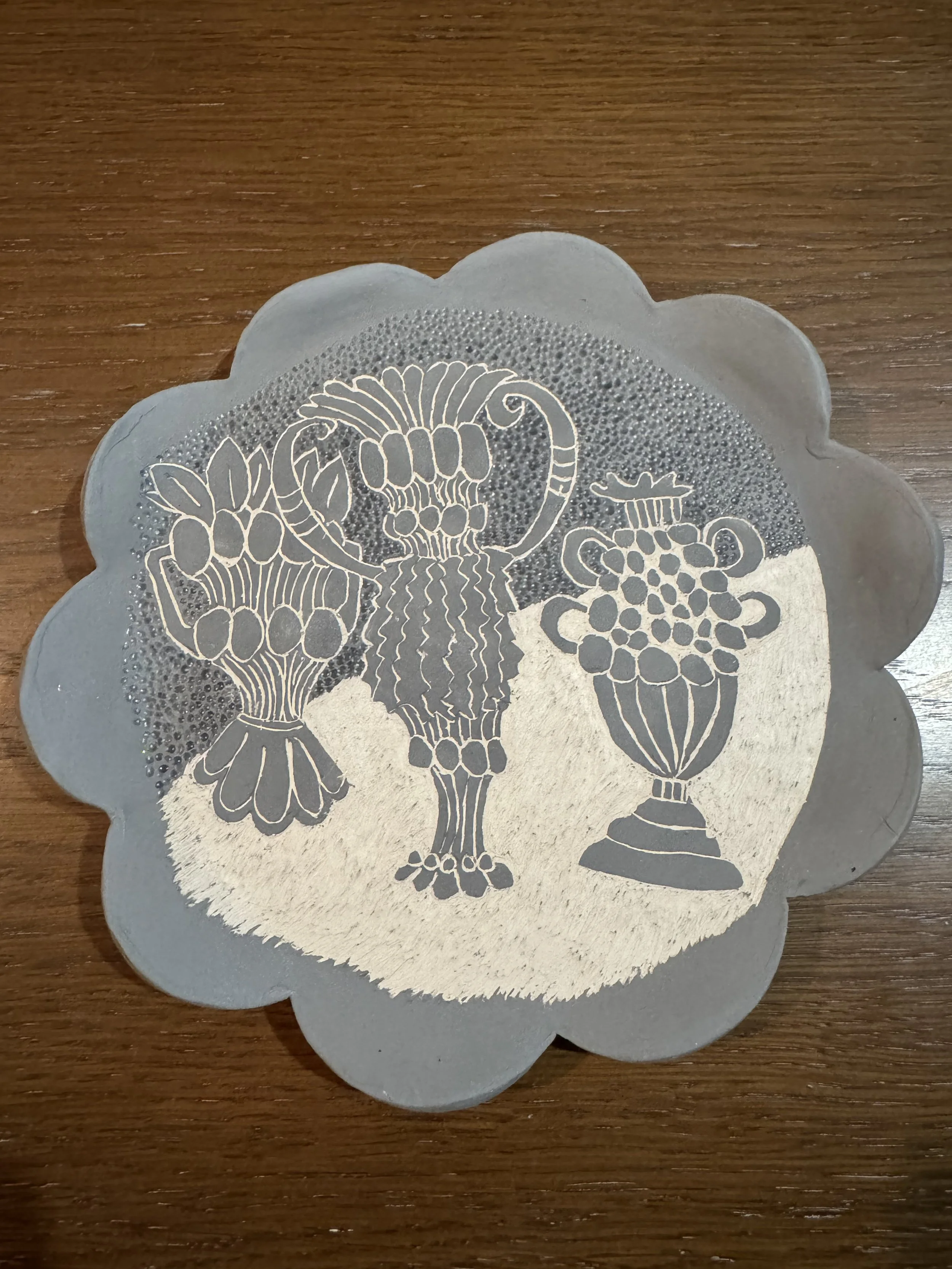Scalloped ceramic plate with sgraffito illustration inspired by Hilary Green's vessels. 