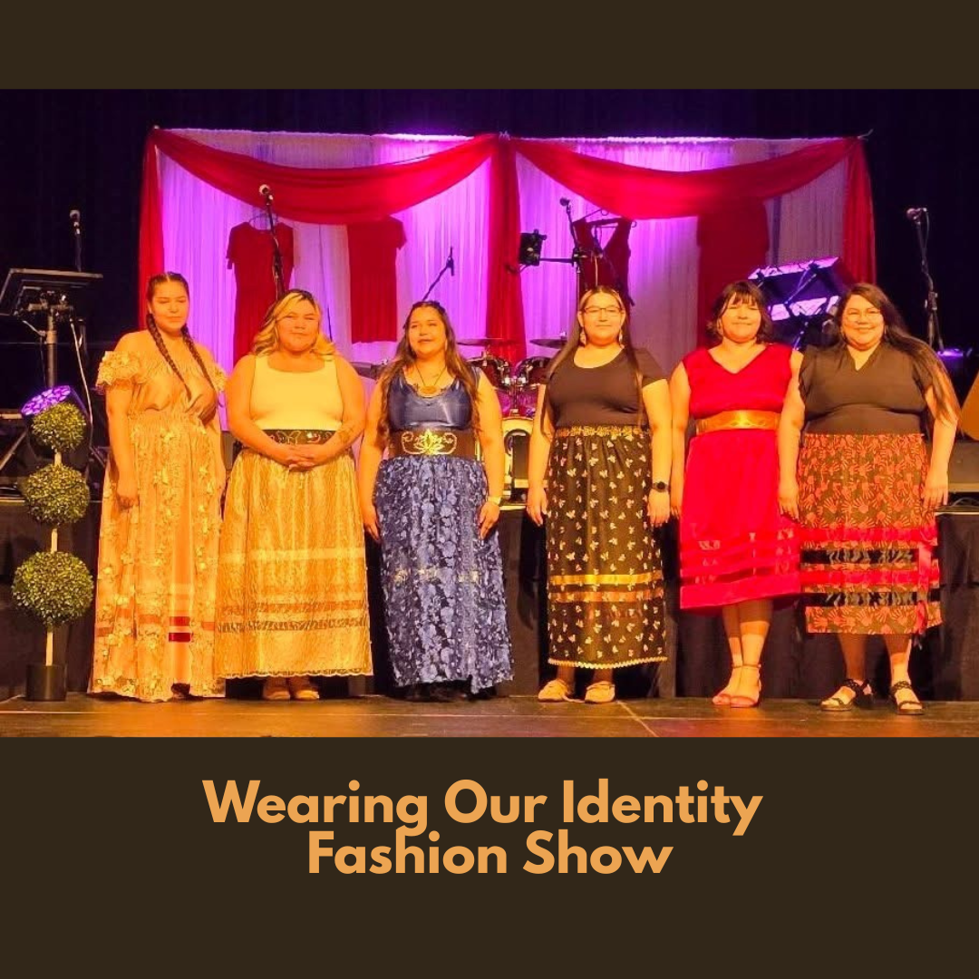 Participants standing on stage during the Wearing Our Identity fashion show, showcasing Indigenous designs and cultural expression.