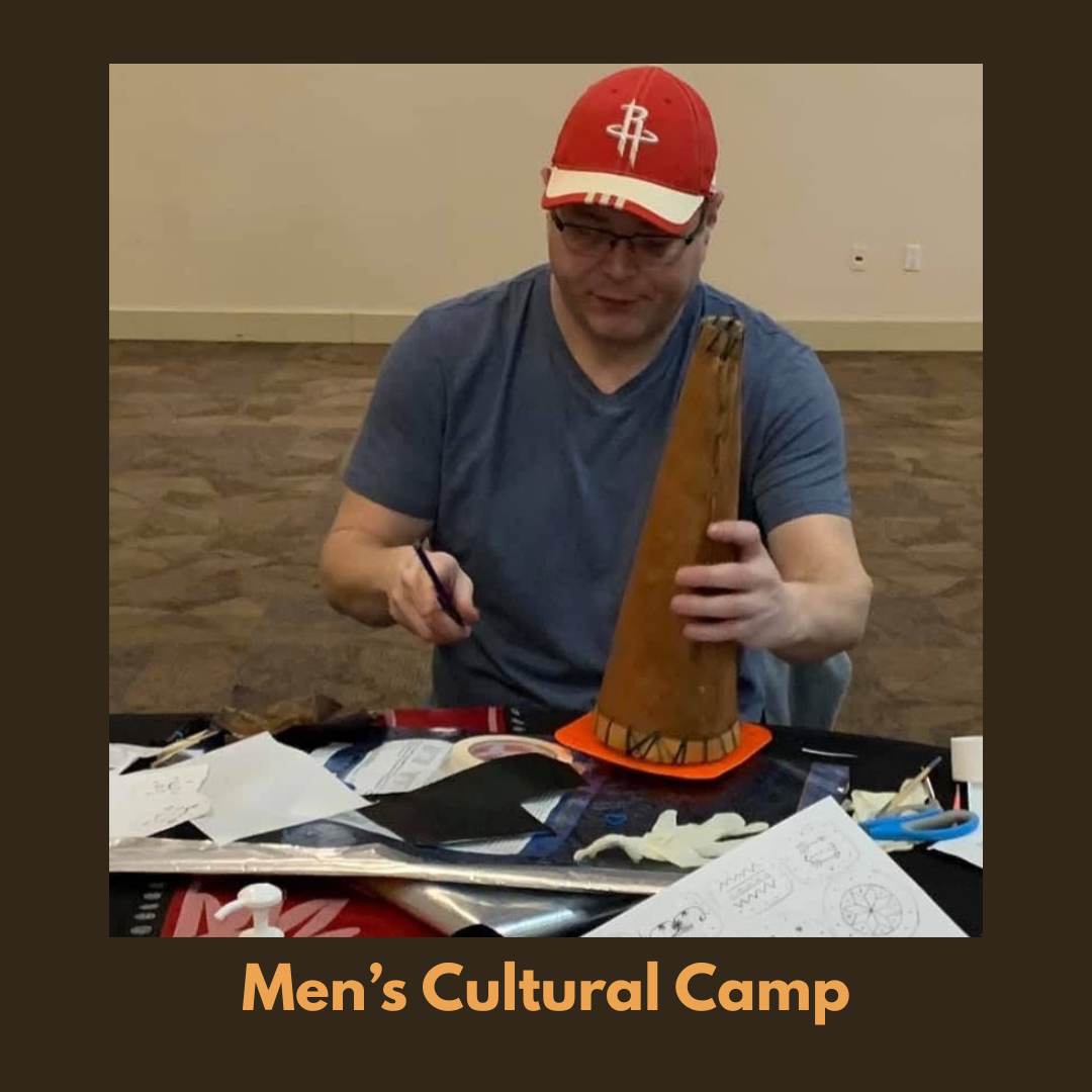 Participant working on a handmade cultural item during a Men’s cultural camp workshop, using traditional materials and tools.