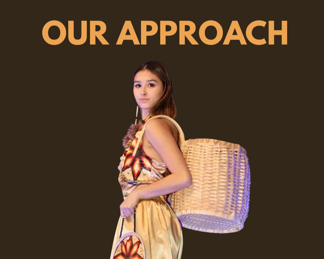 Person wearing contemporary Indigenous-designed clothing and carrying a woven basket, representing a culturally grounded and community-centred approach.
