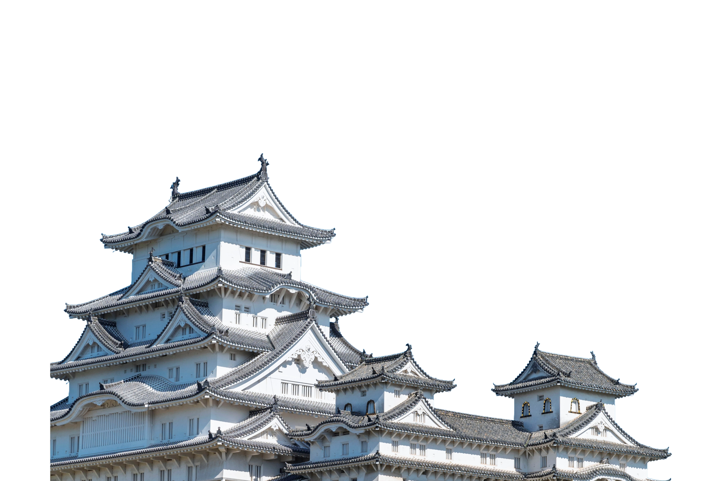 White traditional Japanese castle with multiple tiered roofs and intricate architectural details.