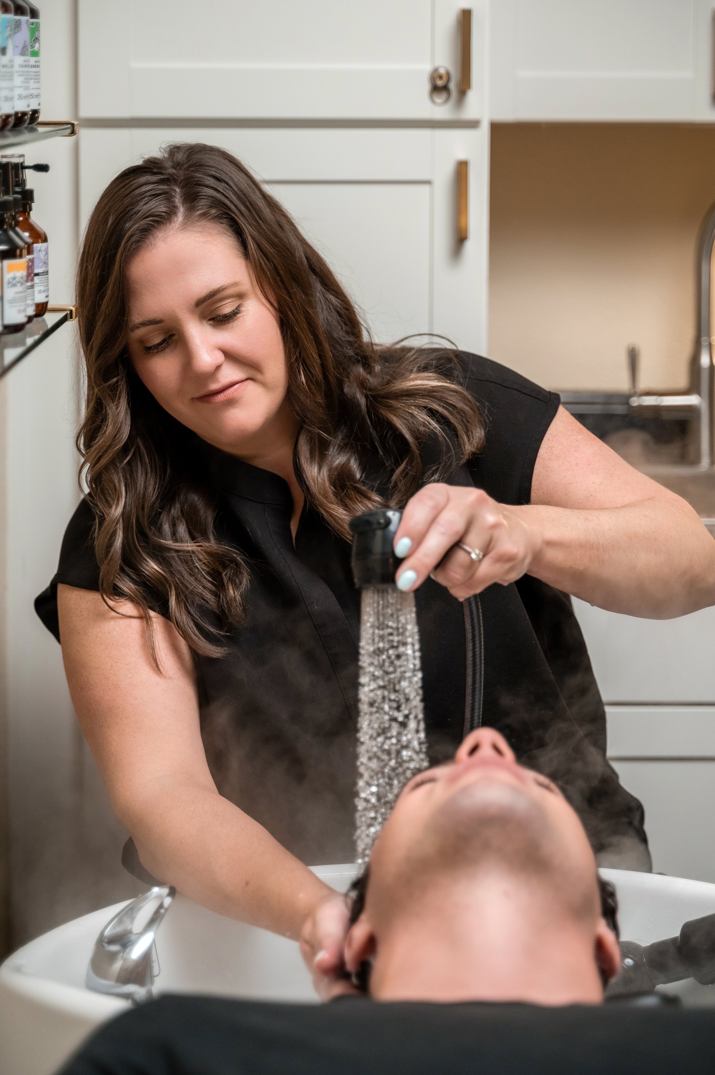 Luxury head spa treatment featuring intentional scalp care and hydrotherapy performed by Hollis Education Collective founder