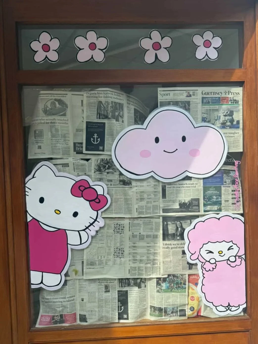 A hand-painted shop window. Perfect for cafes boutiques and children's spaces. Custom window art bring charm to Guernsey windows and footfall boosting visual appeal.