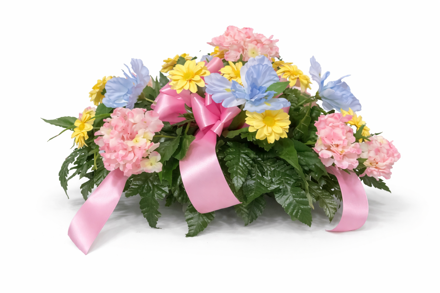 Colorful floral arrangement with pink, yellow, and blue flowers, decorated with pink ribbons, on a white background.