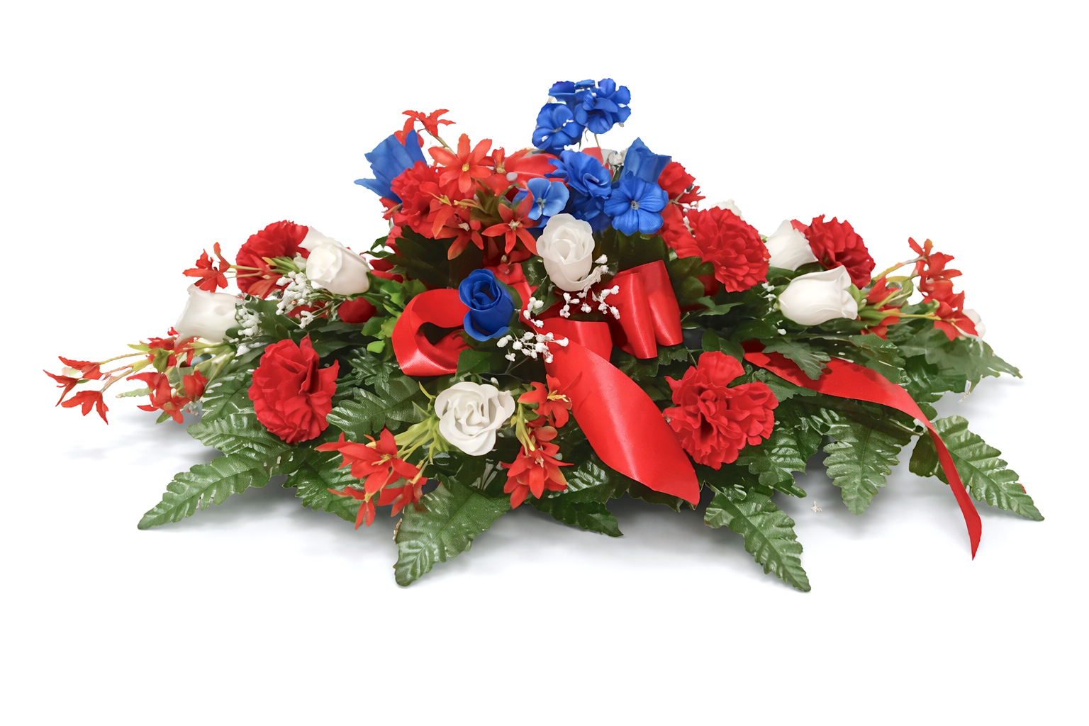 Red, white, and blue floral arrangement with greenery and ribbon.