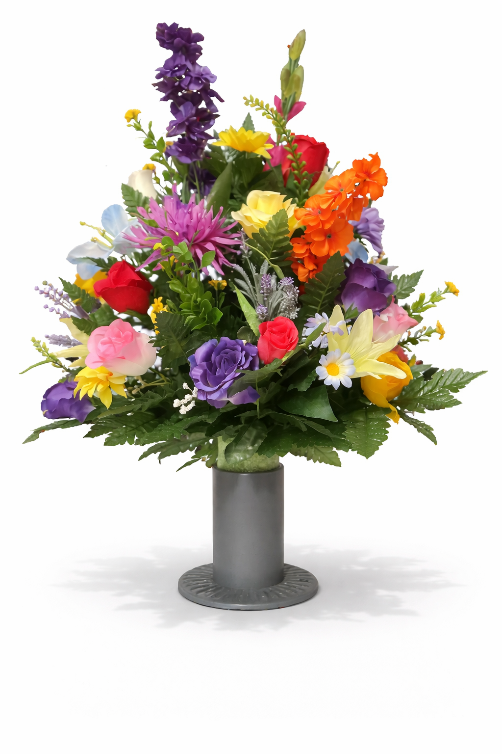 Colorful artificial flower bouquet in a gray vase on a white background.