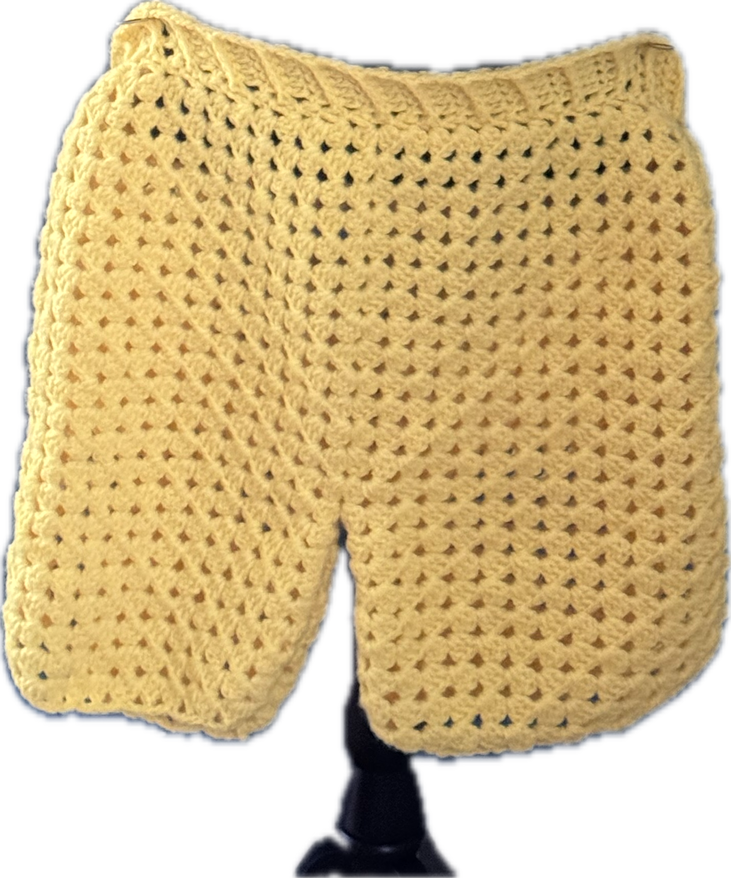 Yellow crocheted neck warmer or scarf with open stitch pattern and black neck strap.
