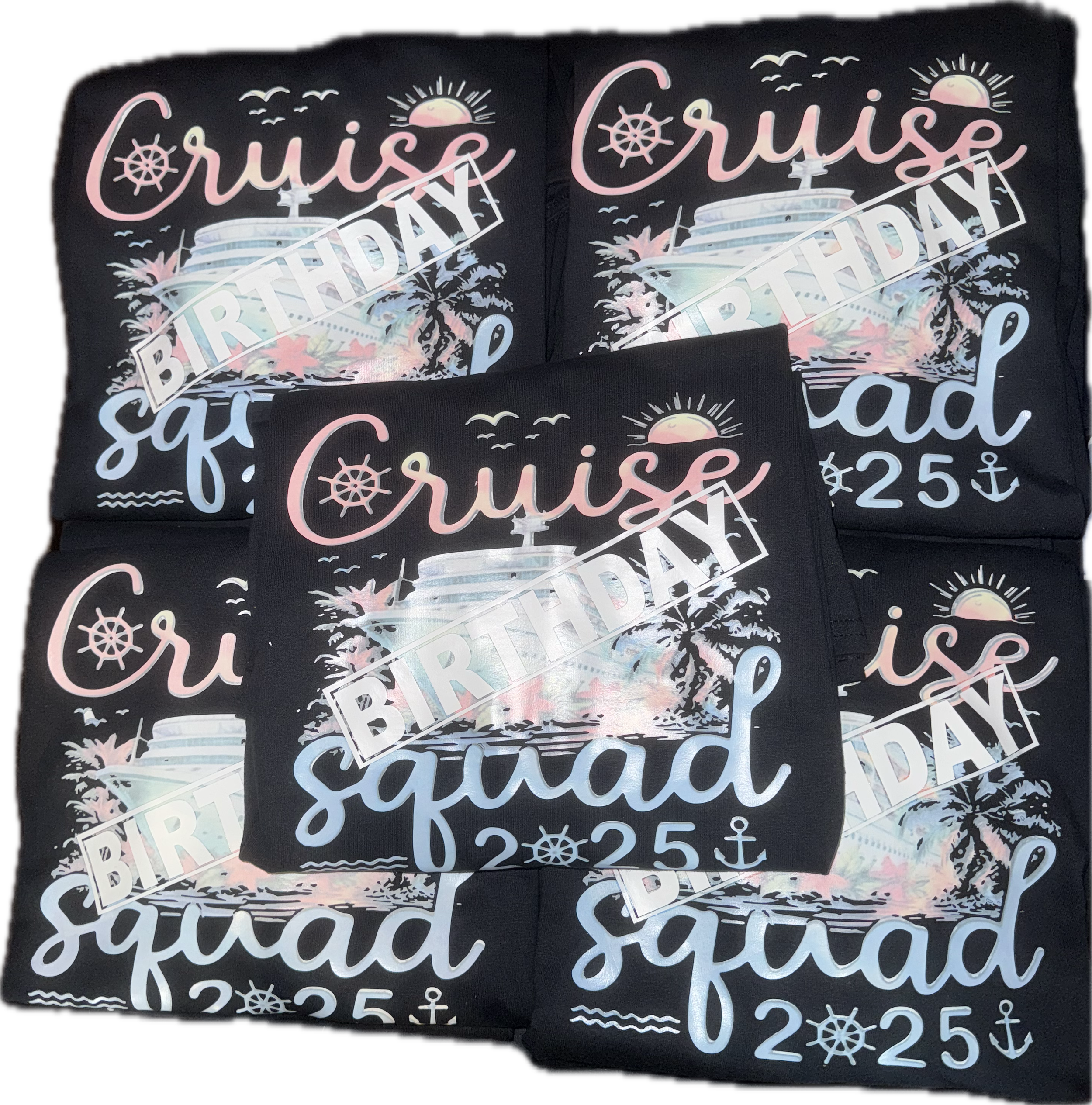 Multiple black napkins with a colorful cruise-themed birthday design including a cruise ship, sunset, palm trees, seagulls, and the text 'Cruise Squad 25'.