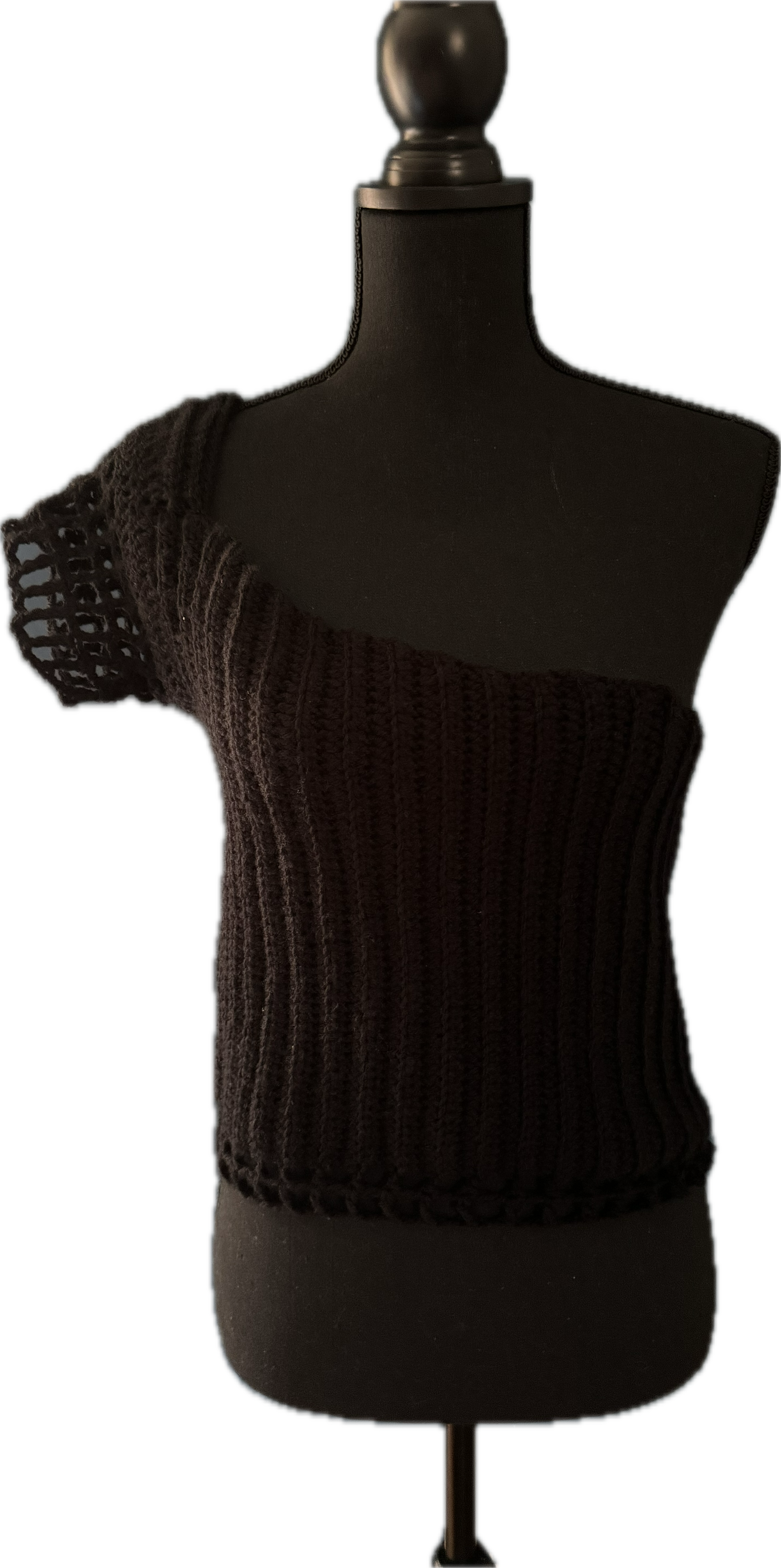 Black knit one-shoulder top on a black mannequin