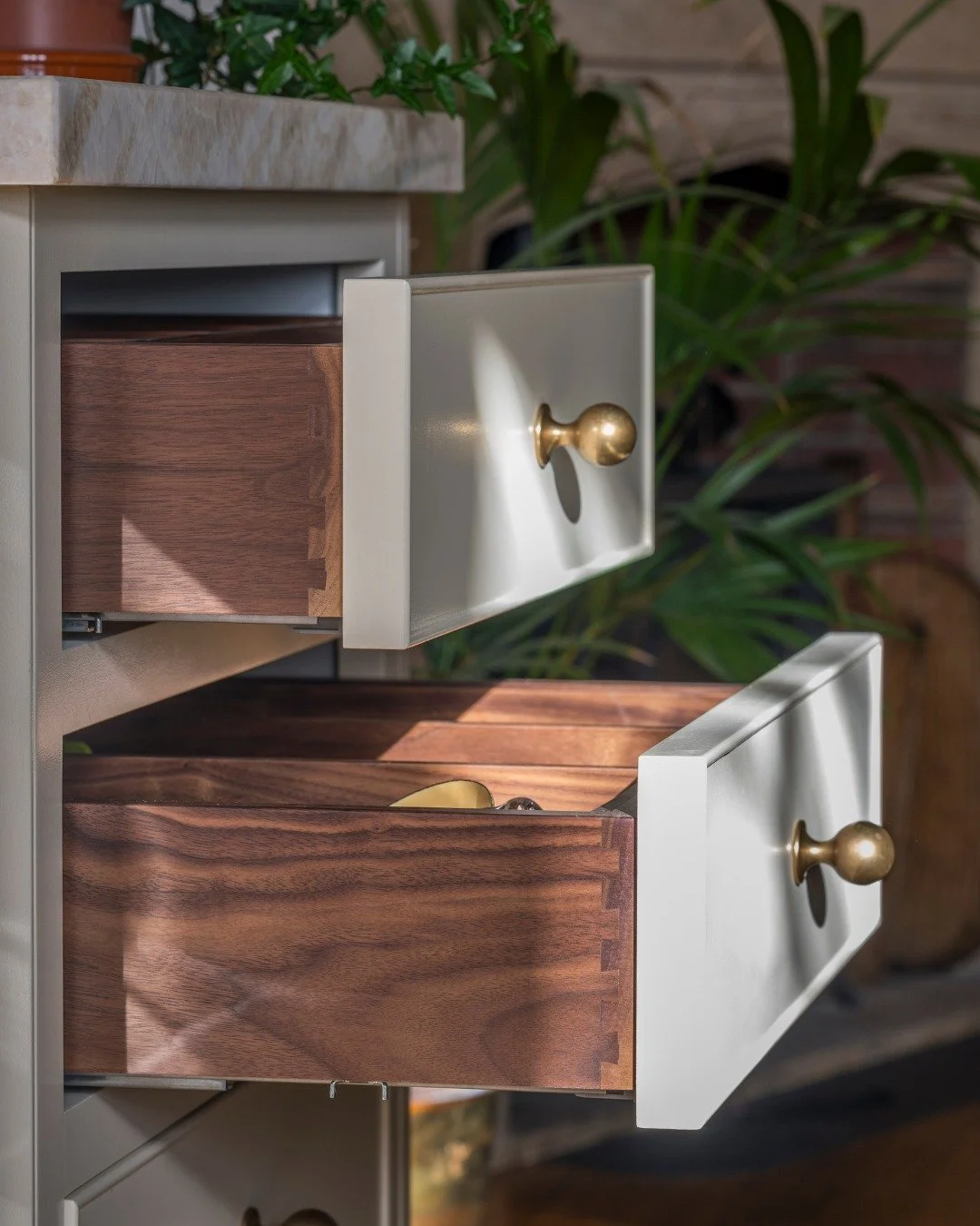 A kitchen that asked something of us.

Leaded windows, vaulted ceilings, a building with centuries of character.

The brief was to create a kitchen that could hold its own - and feel as though it had always been there. Our team suggested copper-trimm