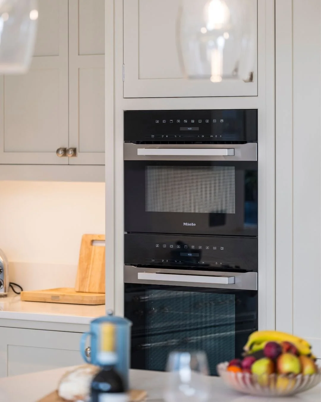 When a client asks for ovens that will still perform in twenty years, there is one answer.

Miele. Specified here as a full tower &mdash; oven, combination microwave and warming drawer &mdash; built flush into hand-painted cabinetry. The integration 