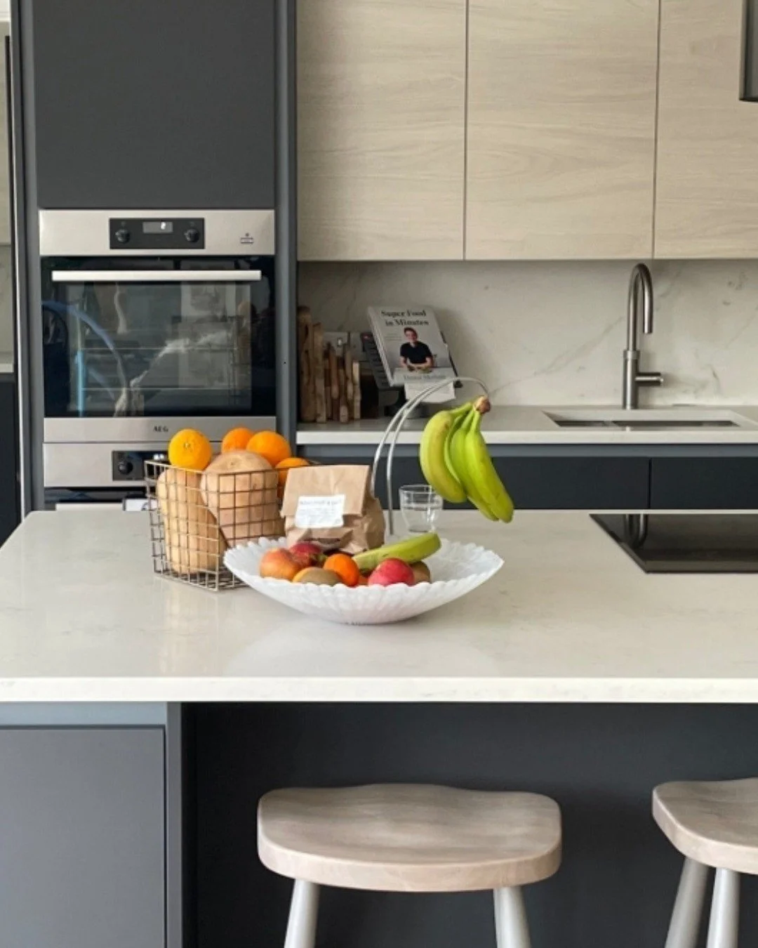 No better place to enjoy a bank holiday weekend than at home in your new kitchen.
 
This project is a lovely contemporary grey handleless kitchen with best-selling Miele appliances integrated throughout. Clean lines and a layout designed around the r