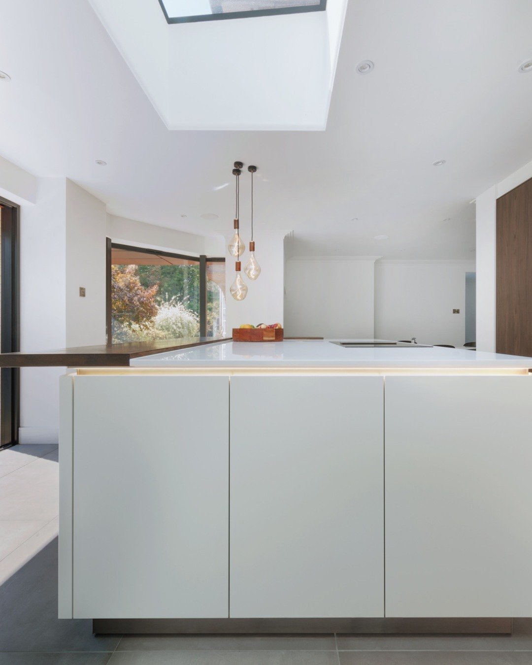 Clean lines, floor-to-ceiling cabinetry and integrated appliances that disappear into the design. This handleless kitchen was built around the idea that nothing should interrupt the wall- every detail resolved before a single unit was ordered. 

Feat