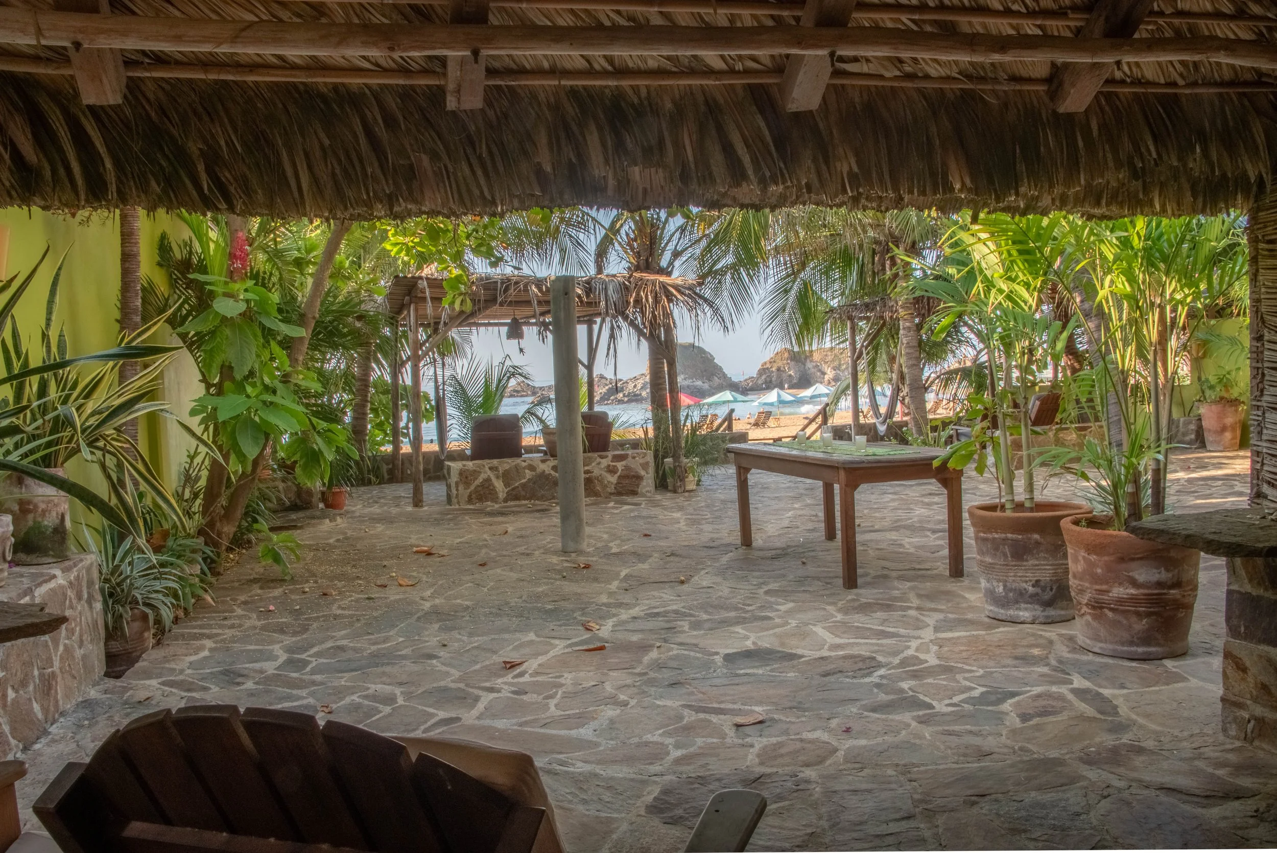 The beachside view looking out to the back patio of Suite II at oceano vacation rental in San Agustinillo in Oaxaca Mexico.