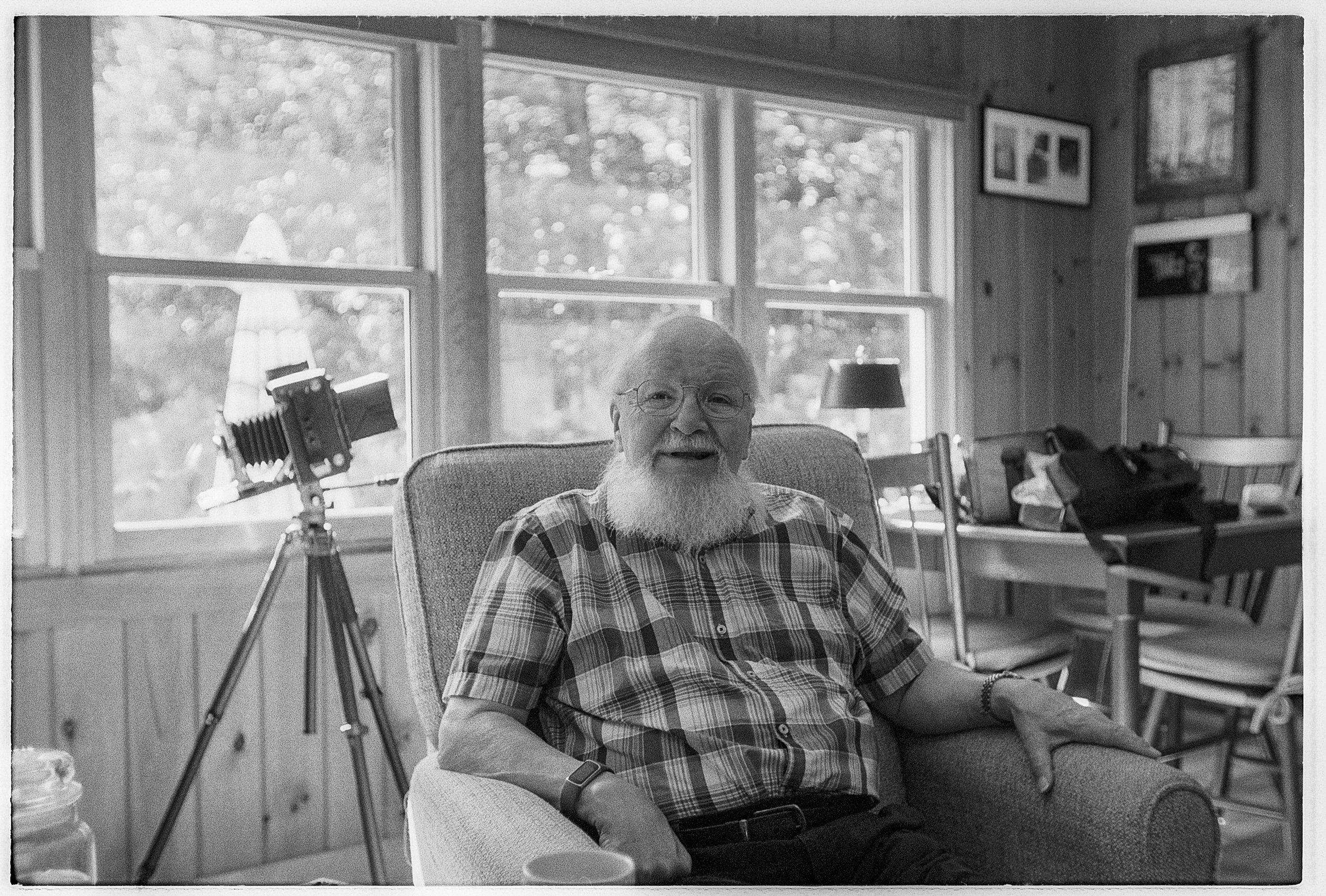 Lenny in his chair with his 4x5 Graflex in the background.