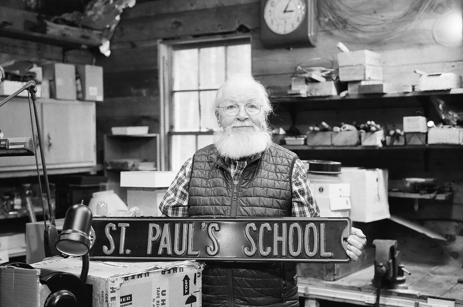 Lenny holding a sign from his time at St. Paul School