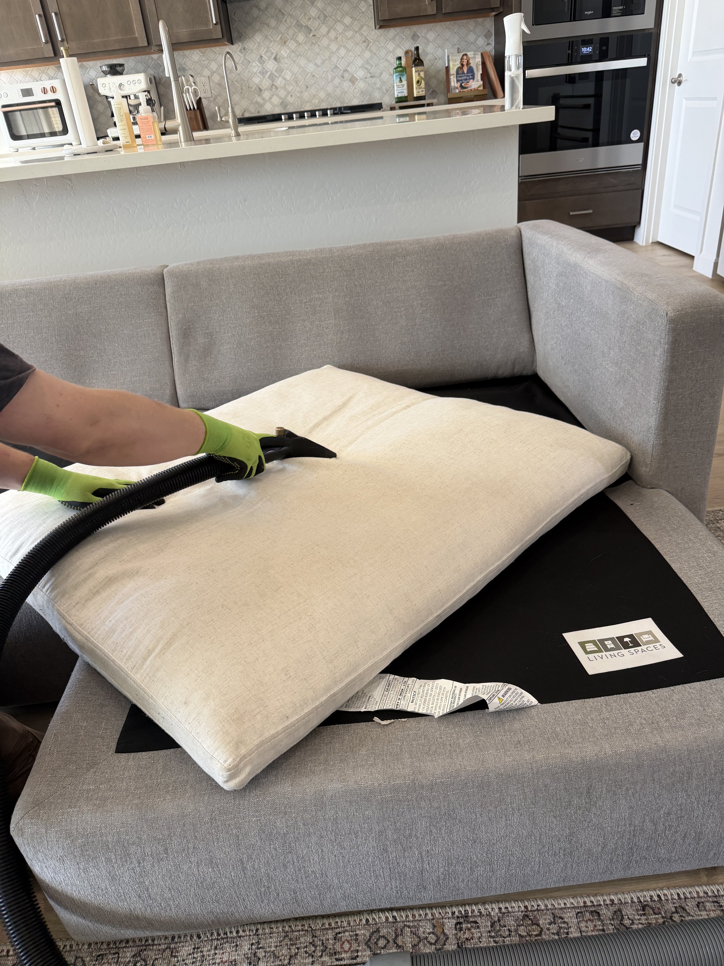 Deep cleaning steam machine used on a couch