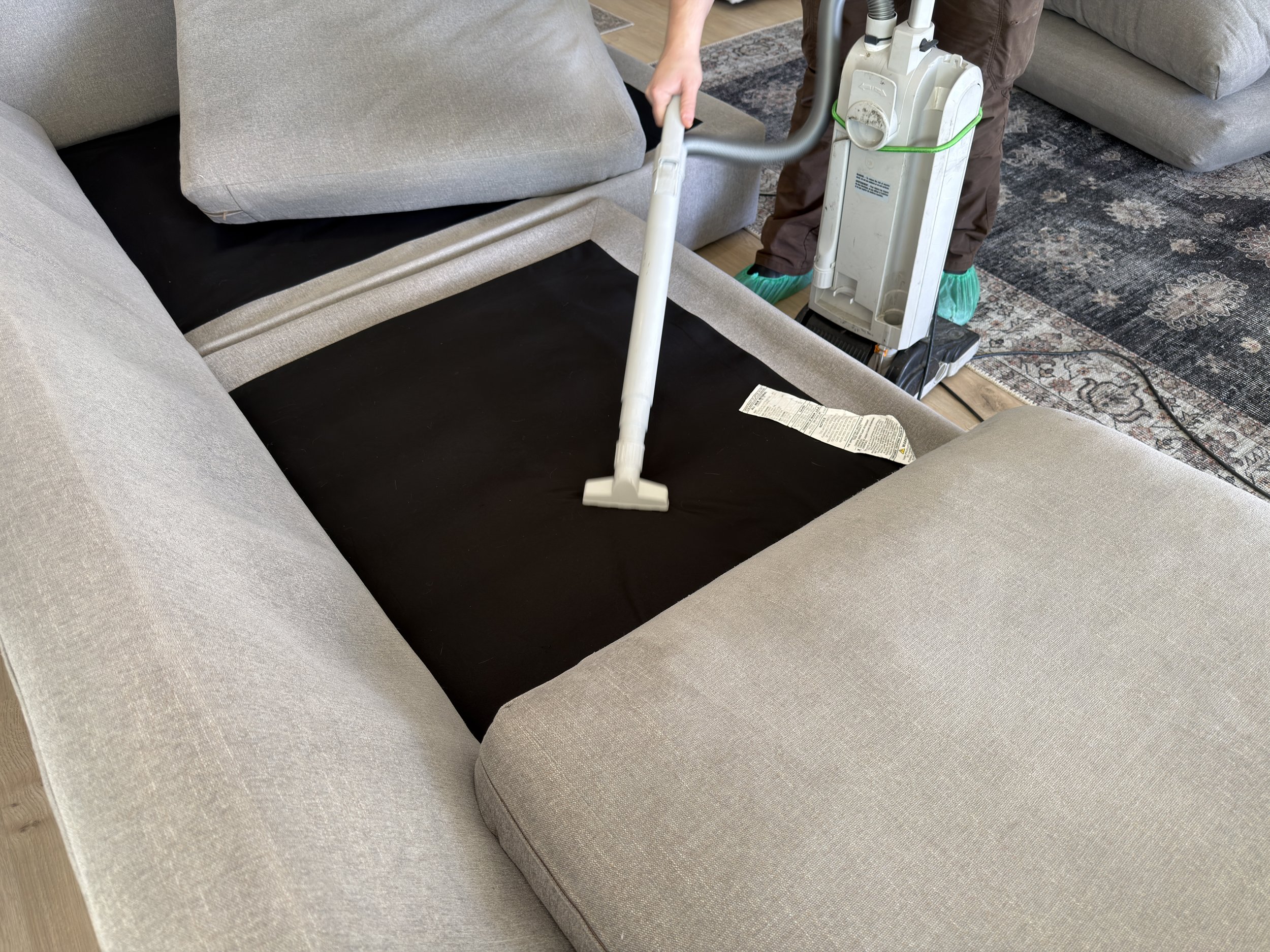 Deep cleaning steam machine used on a couch