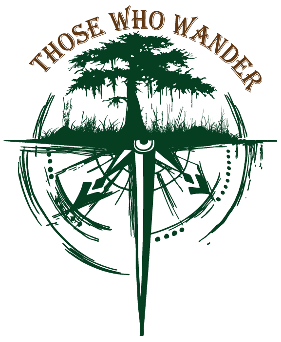 A logo featuring a large tree growing above a compass, with the text "THOSE WHO WANDER" arching above the tree. Those Who Wander Logo