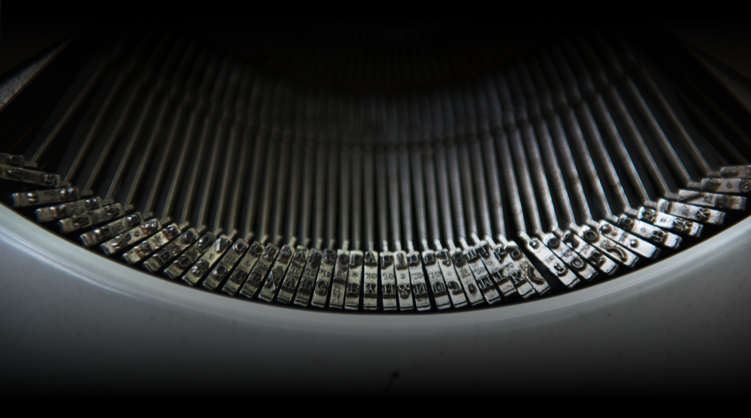 Close-up of the typewriter's metal type bars and characters.