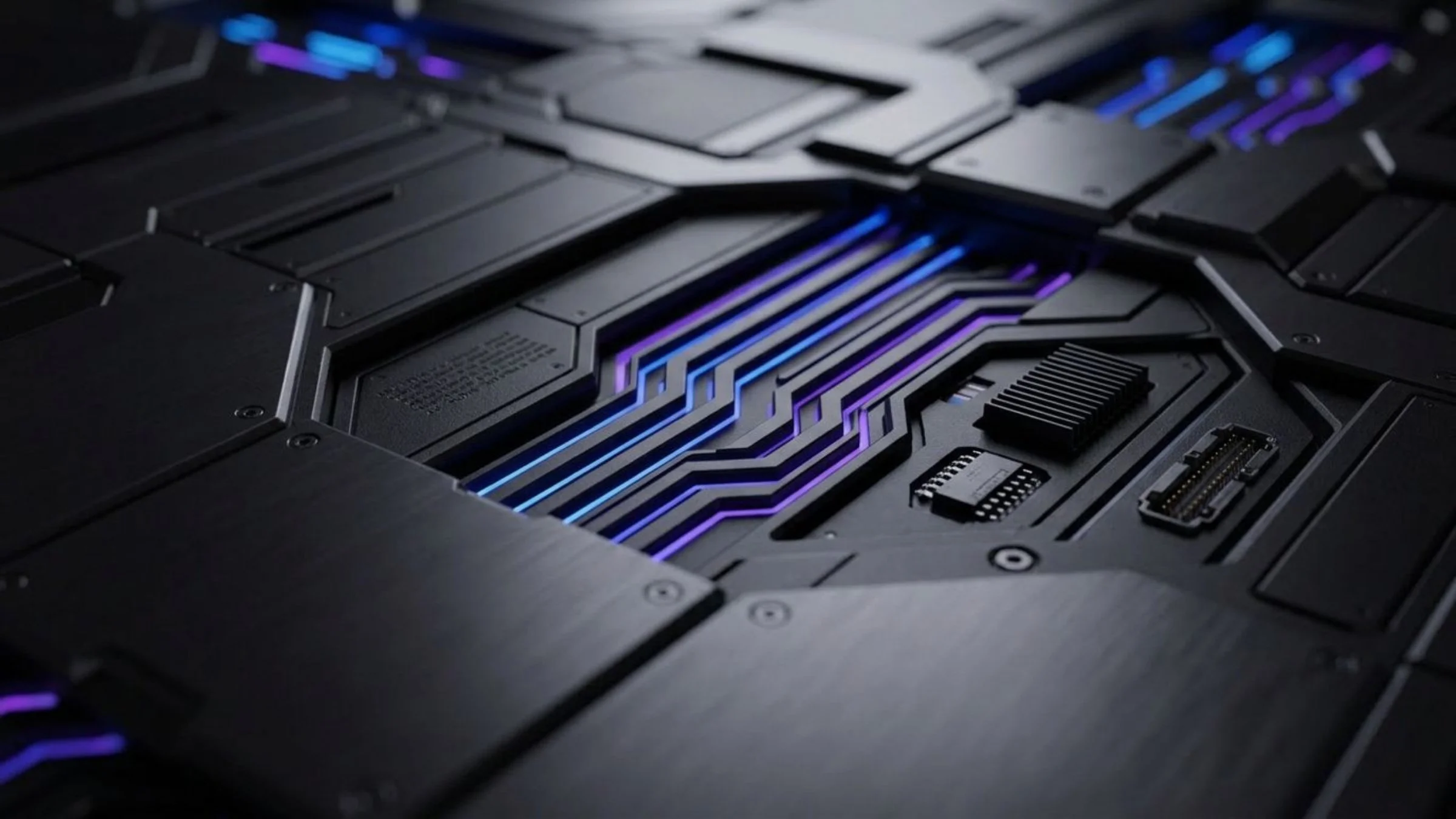 Close-up of a futuristic, high-tech black electronic circuit board with illuminated blue and purple accents.