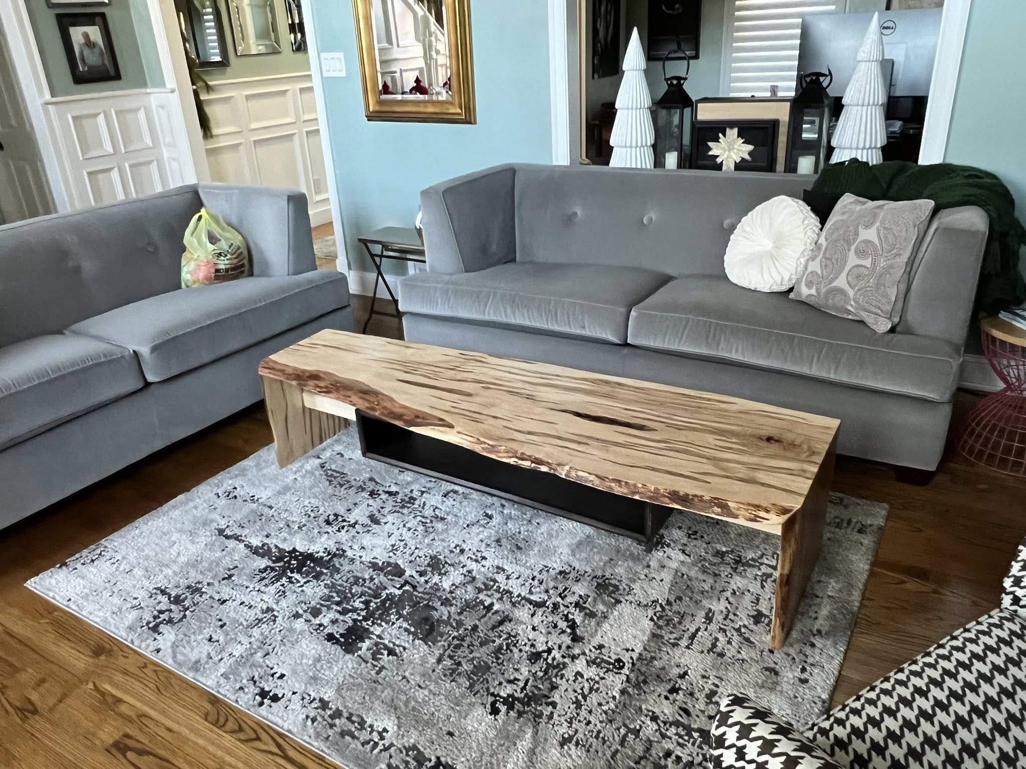 Living room with a wooden coffee table built by a woodworker from The Woodwork Shop.