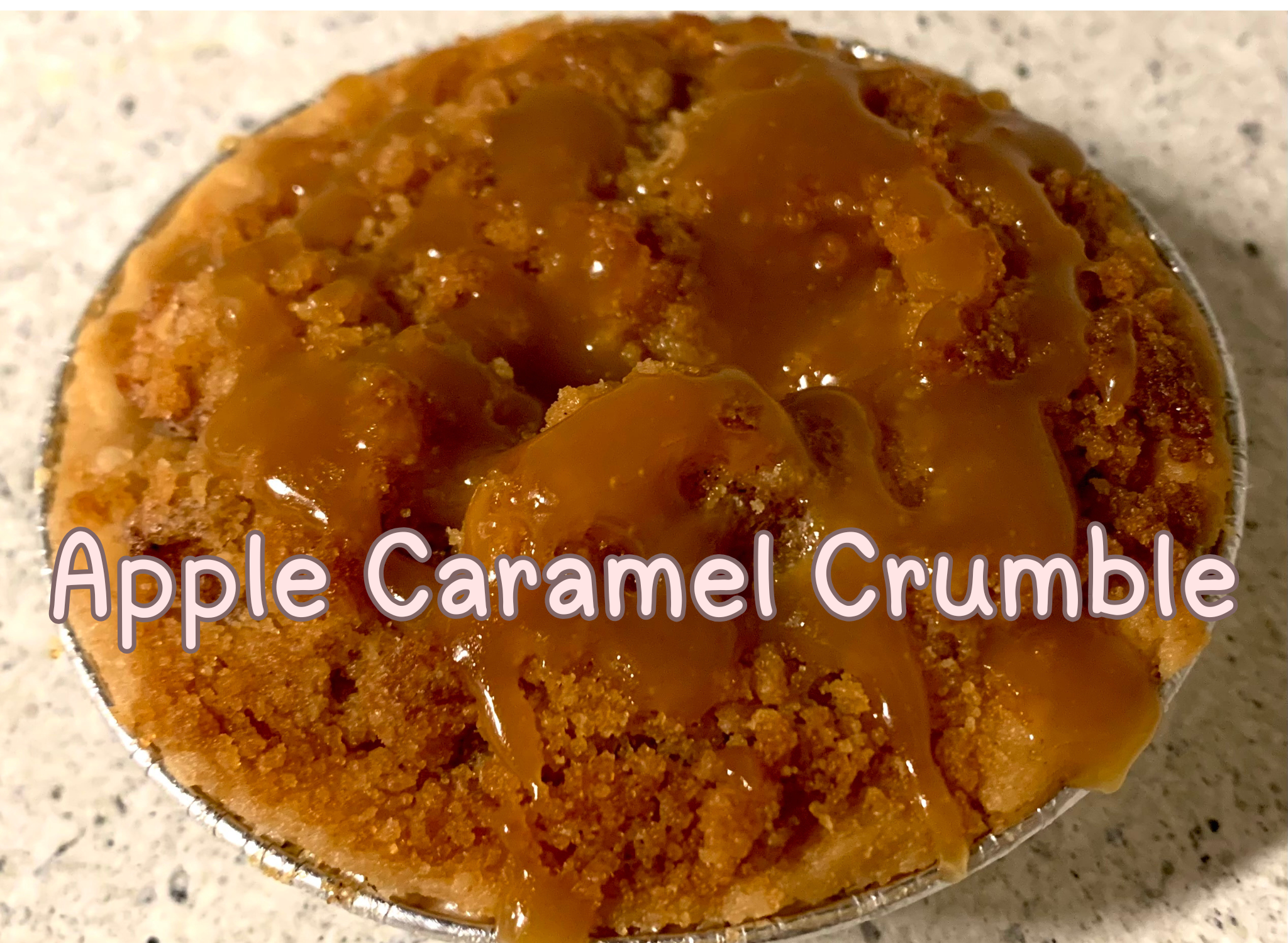 Mini apple caramel crumble pie topped with brown sugar crumble topping.