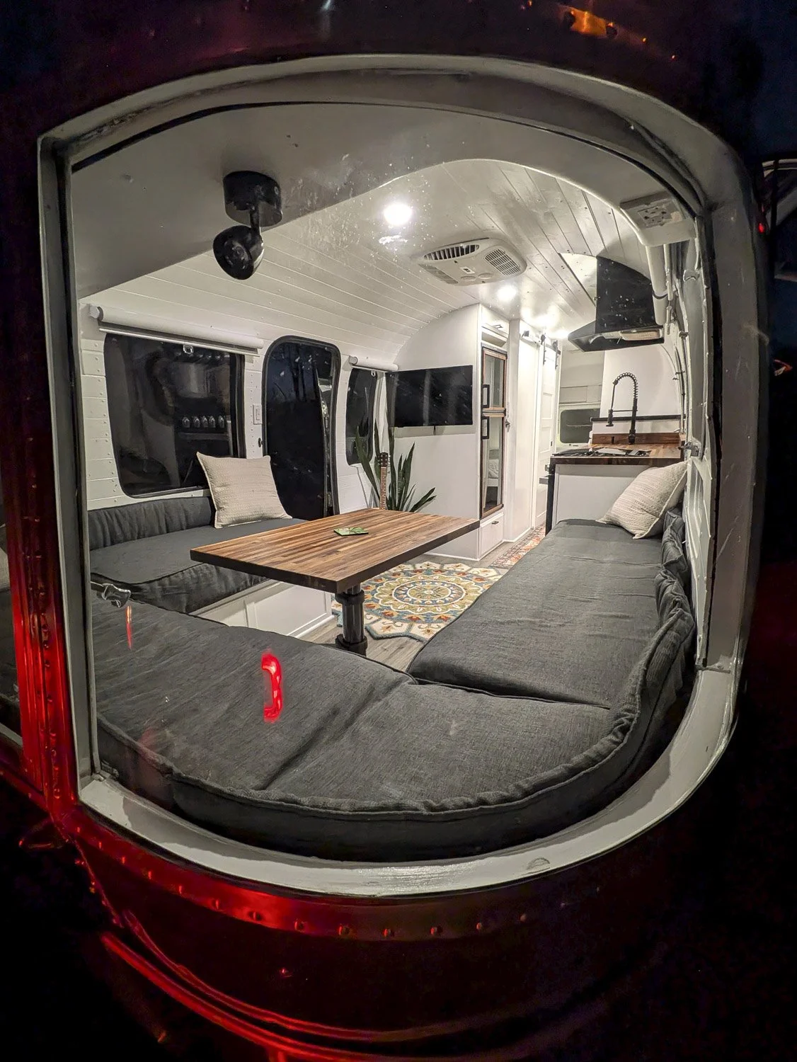 Wraparound Windows are one of the details that make Vintage Airstrream interiors feel so open and connected to the outdoors.