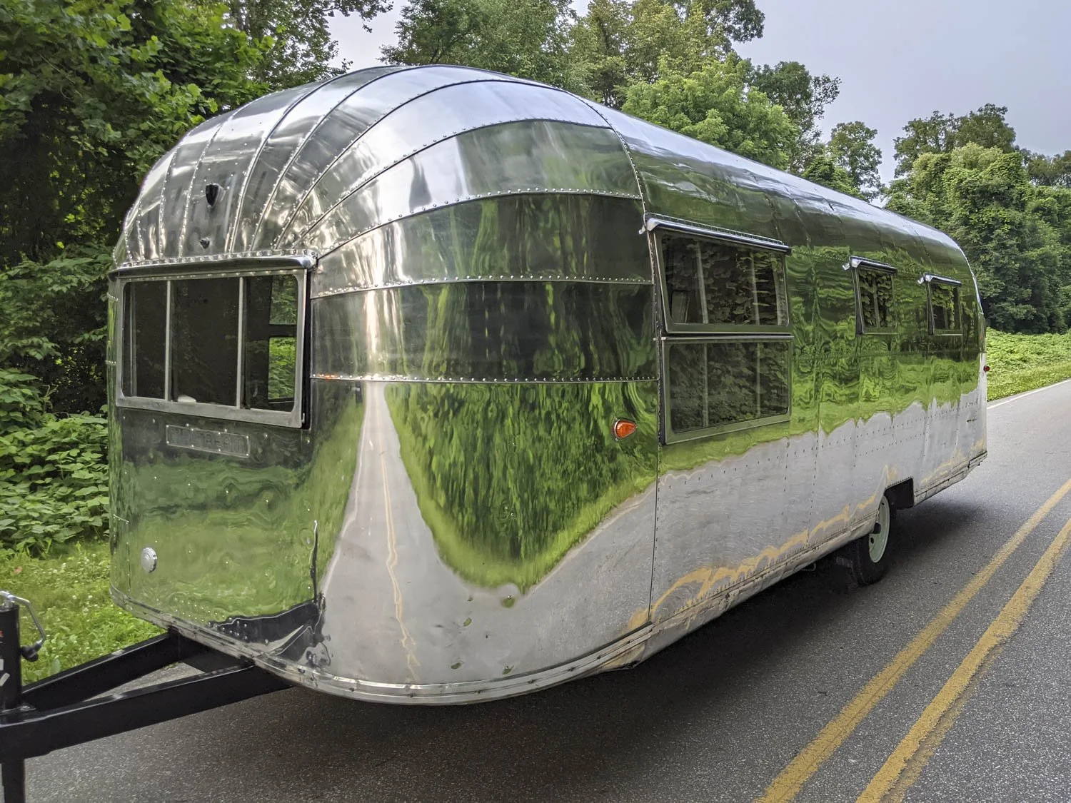Vintage modern mash-up of unique mirror polished Airstream rebuild and renovation by Dragonfly Campers of Asheville, NC-14.JPG