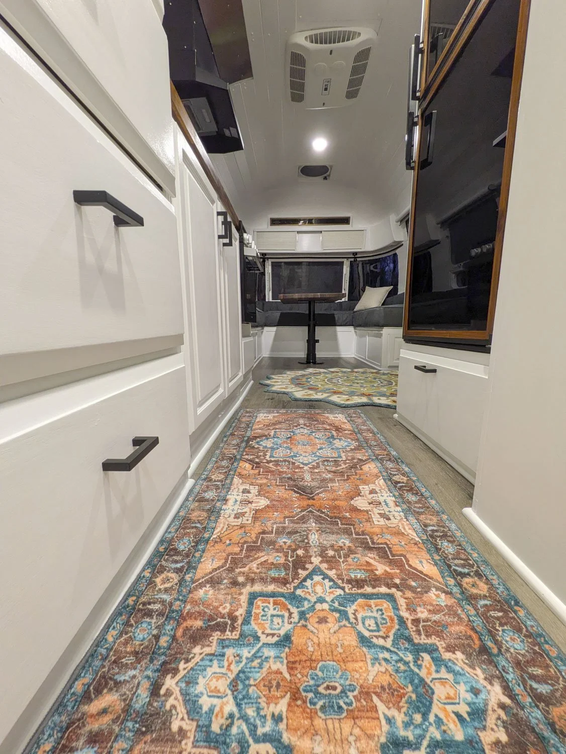 All Cabinetry throughout the camper was completely rebuilt custom using solid wood for improved durability and longevity over the original hollow core construction.