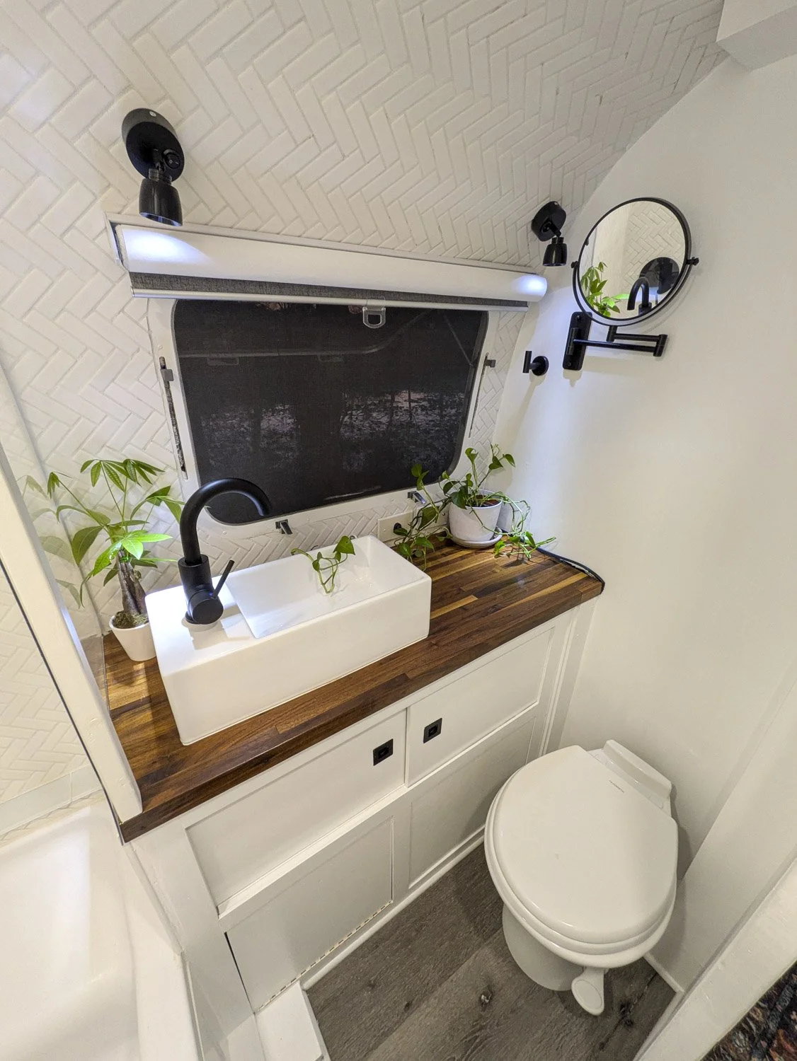  The Modern Bathroom features an easy to clean vessel sink, and convenient storage below.