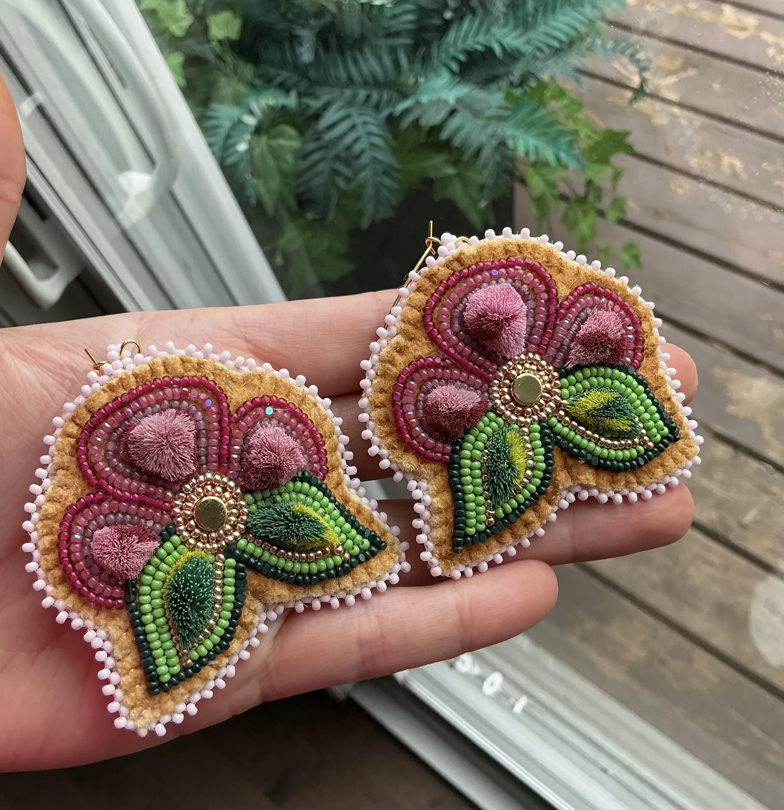 Beaded and caribou tufted floral earrings
