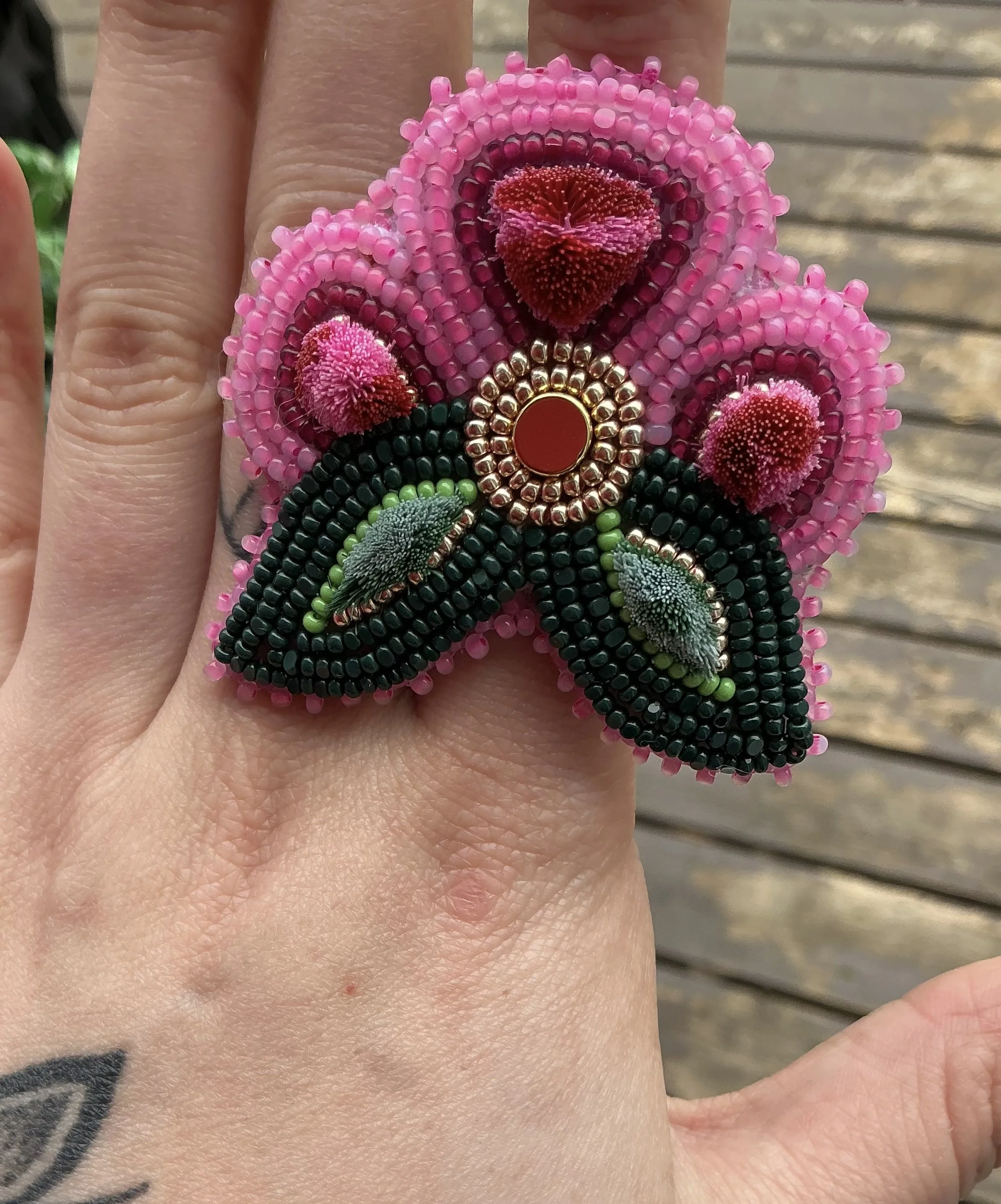 Beaded and tufted ring