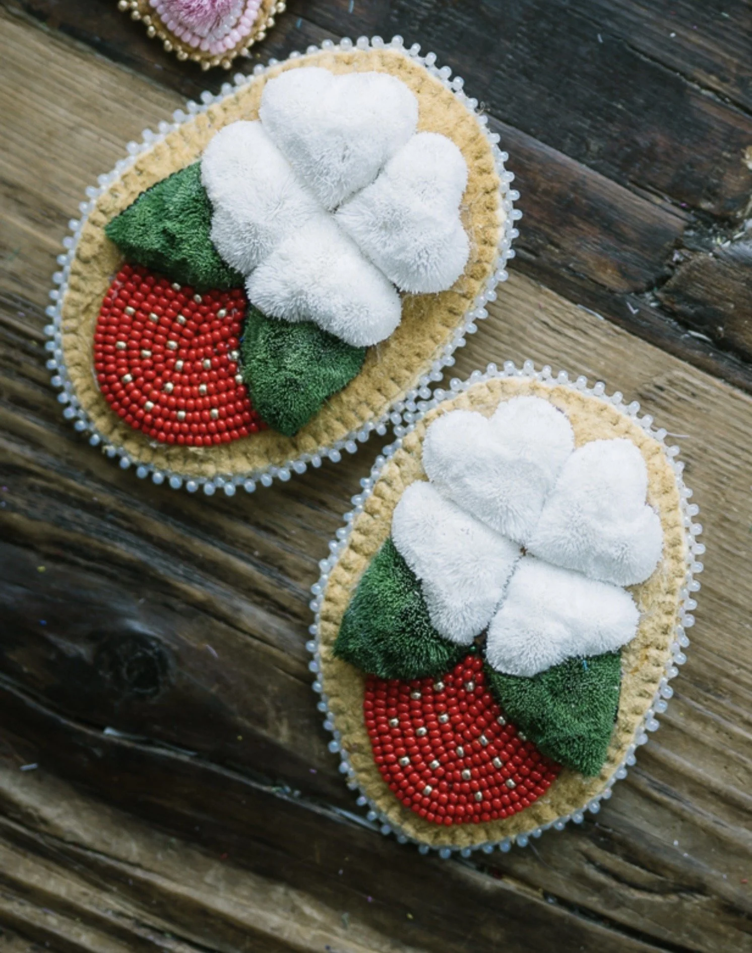 Beaded and caribou tufted strawberry floral