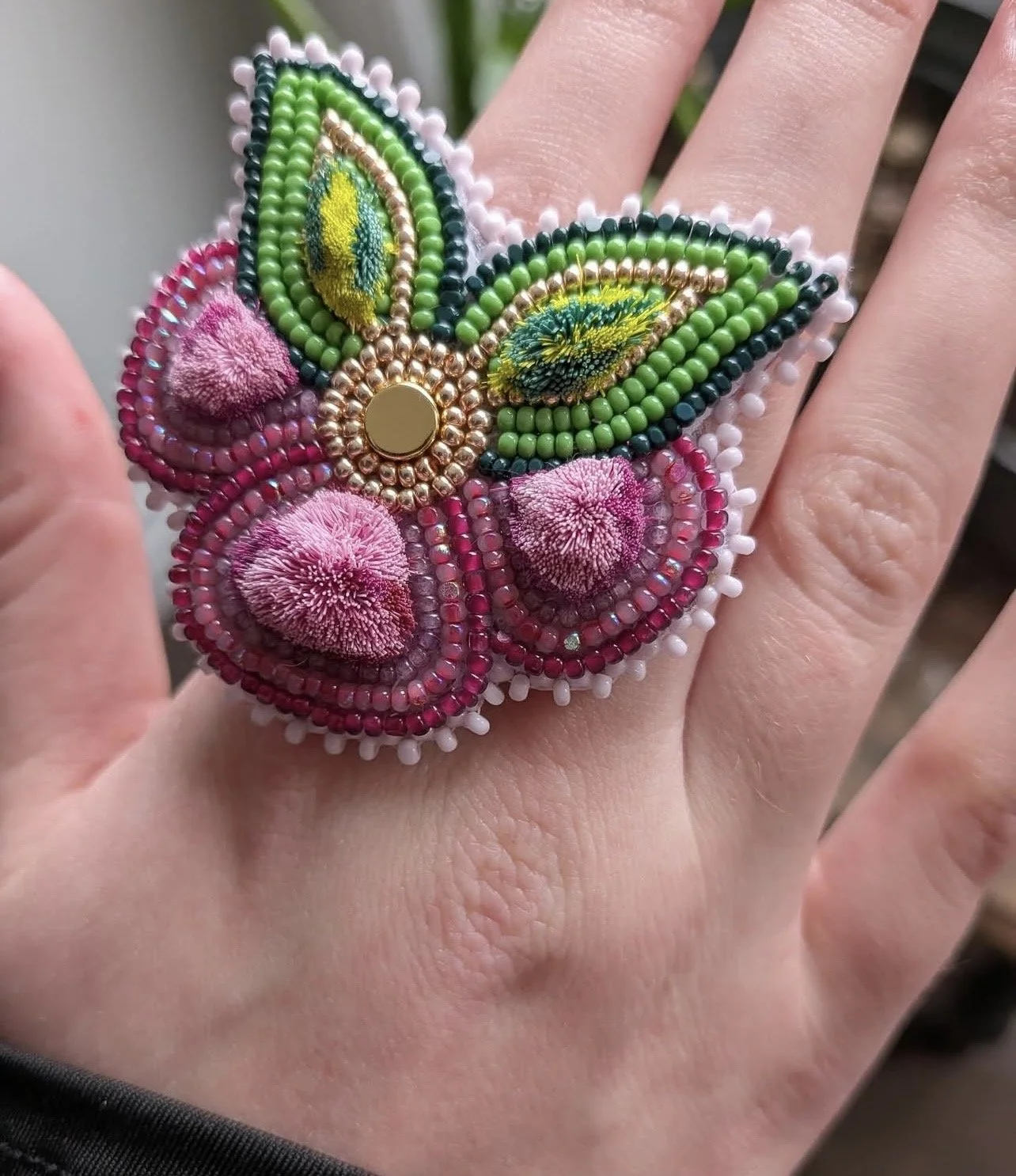 Beaded and caribou tufted ring
