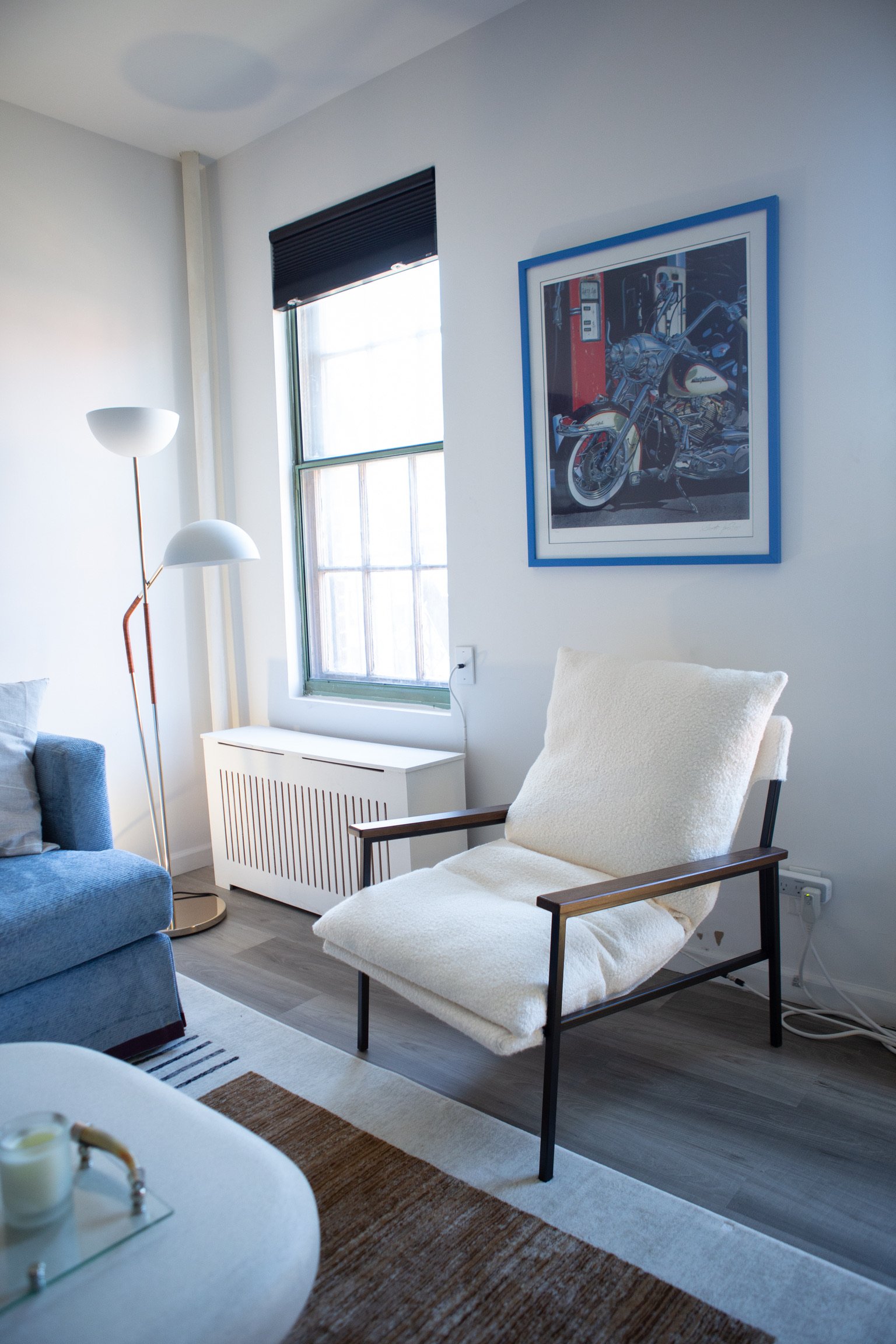 A blue couch and chair are positioned in a stylish living room, creating a comfortable seating area.