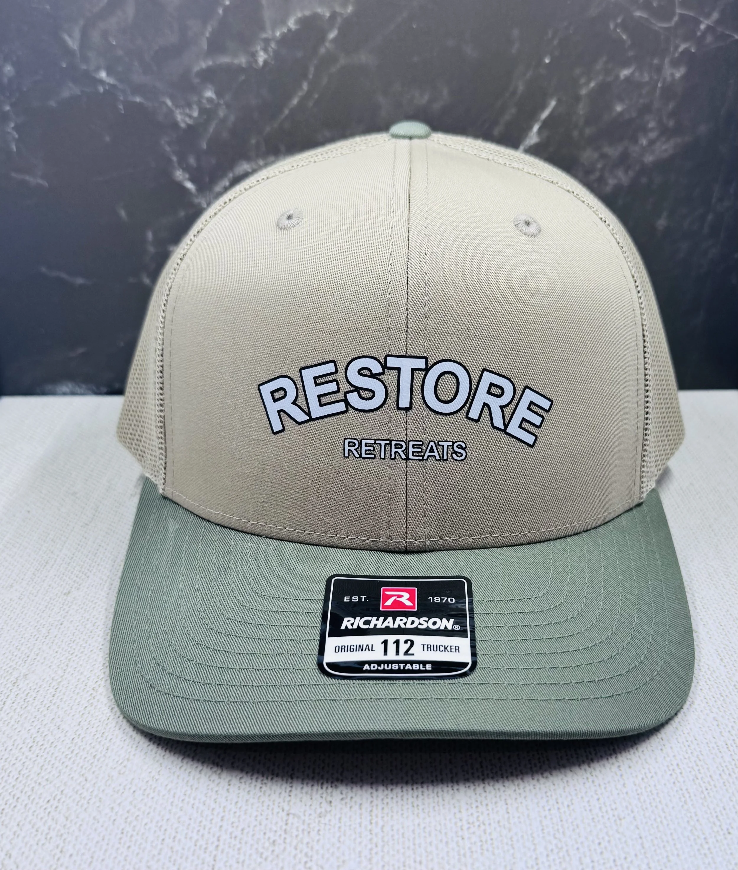For Restore Retreats, we utilized Direct to Film (DTF) transfers to maintain the absolute integrity of their typography. Unlike traditional methods, DTF allowed us to achieve razor-sharp edges and vibrant color consistency on the rugged texture of a 