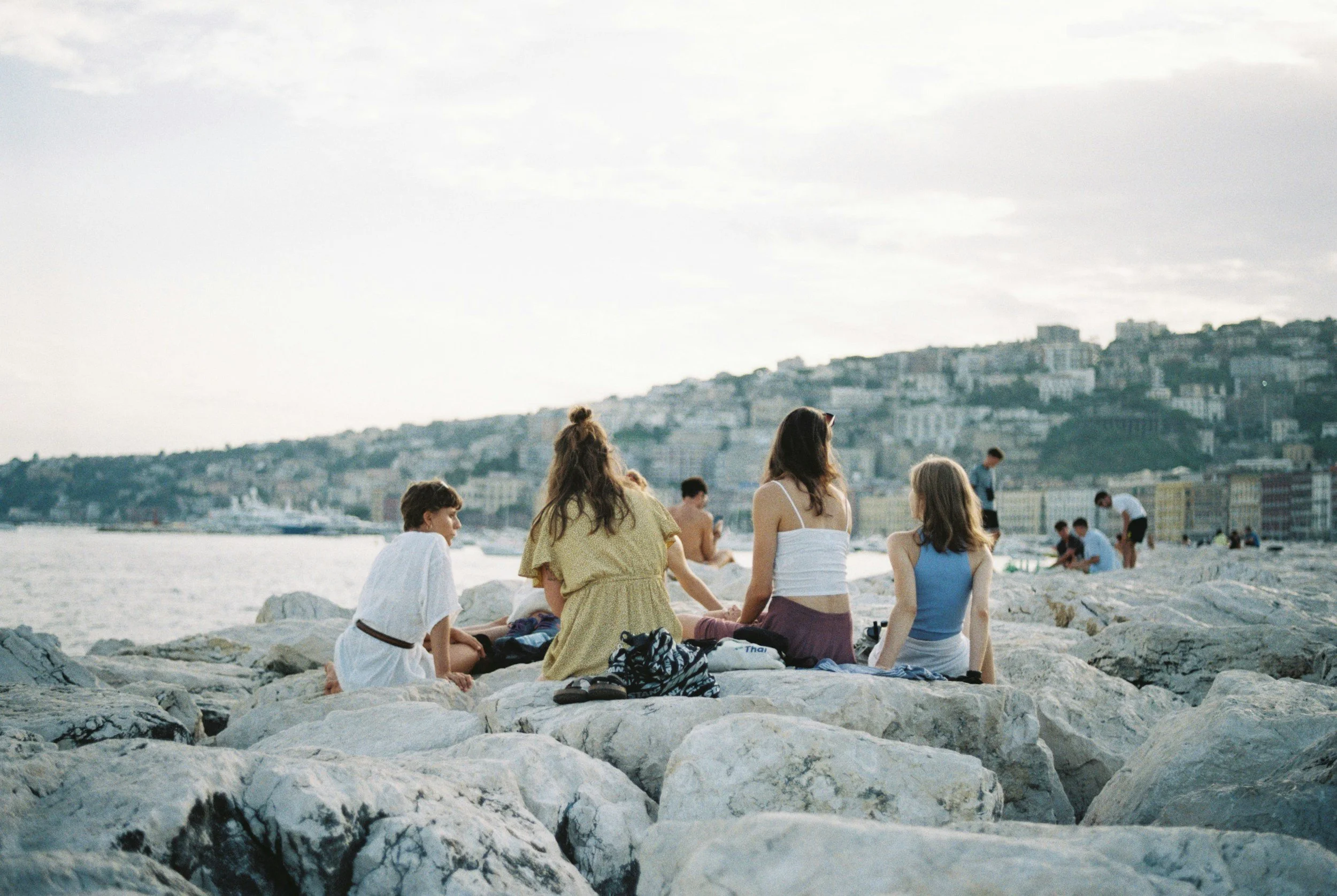 Girls sitting and chatting over rocks