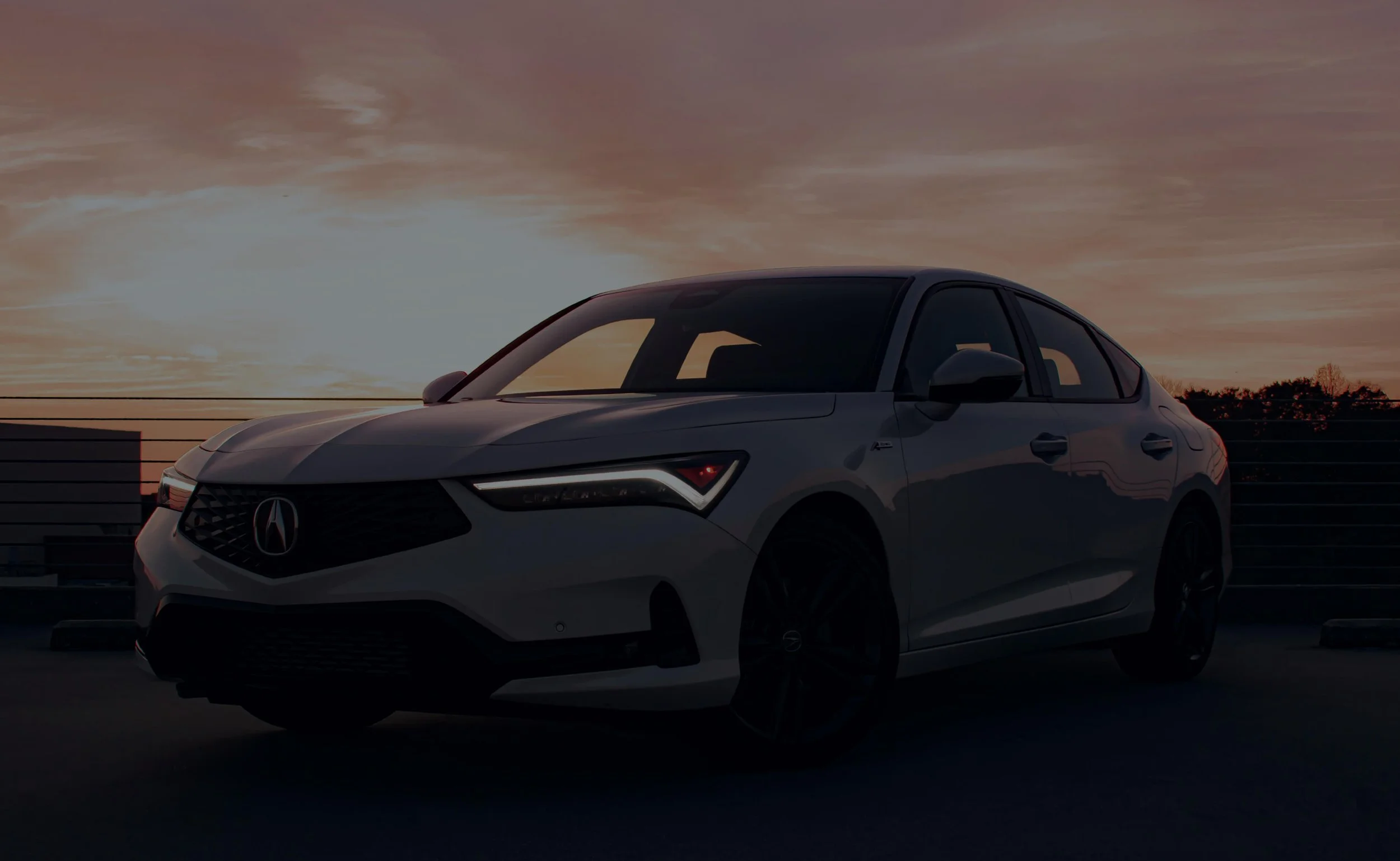 Mobile technician performing brake repair on an Acura vehicle on-site