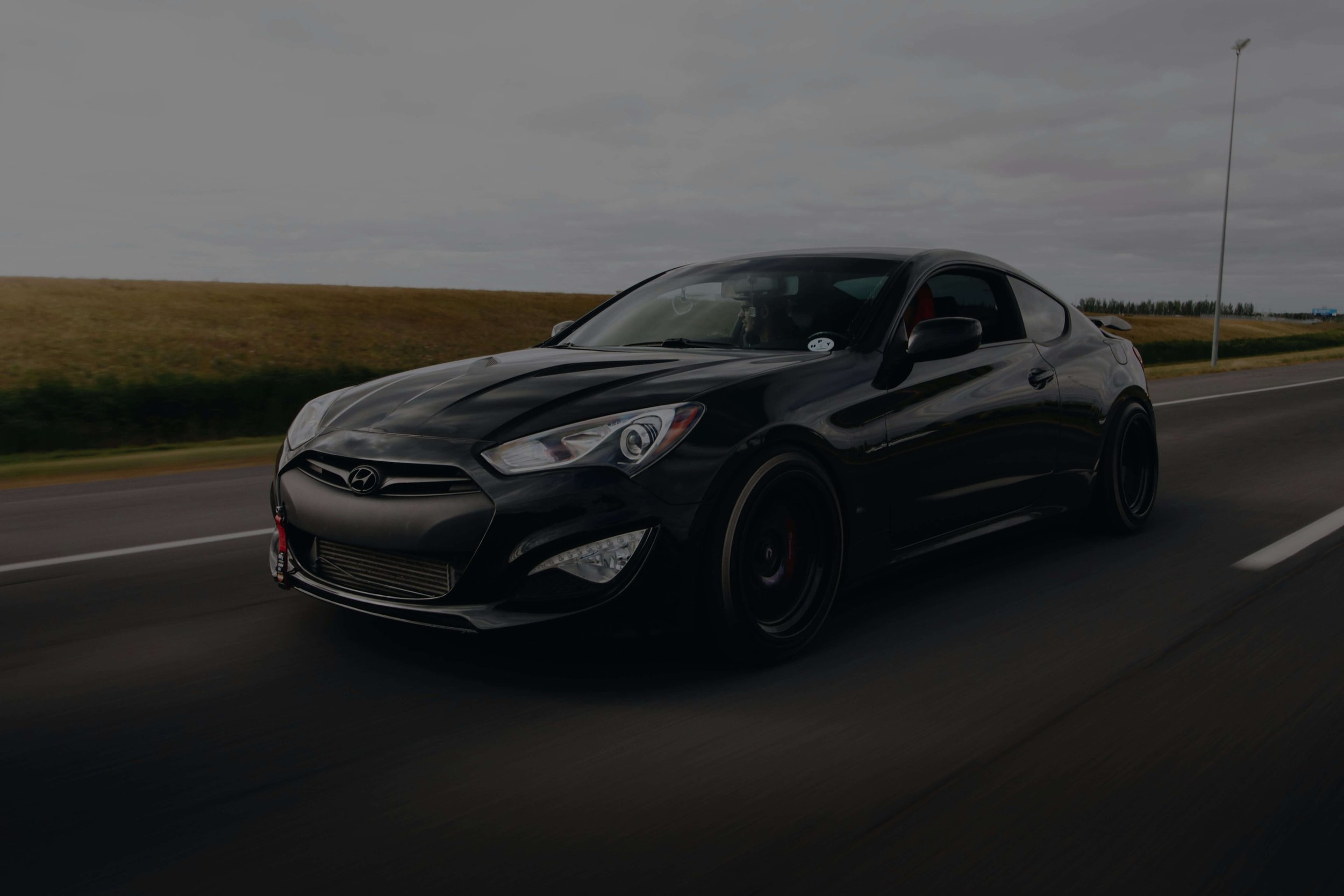 Mobile technician performing brake repair on a Hyundai vehicle on-site