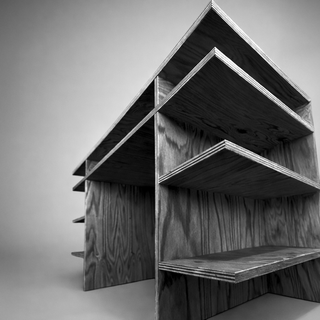 A black-and-white photo of a modern, multi-level wooden shelf with a geometric design. Inspired by Donald Judd