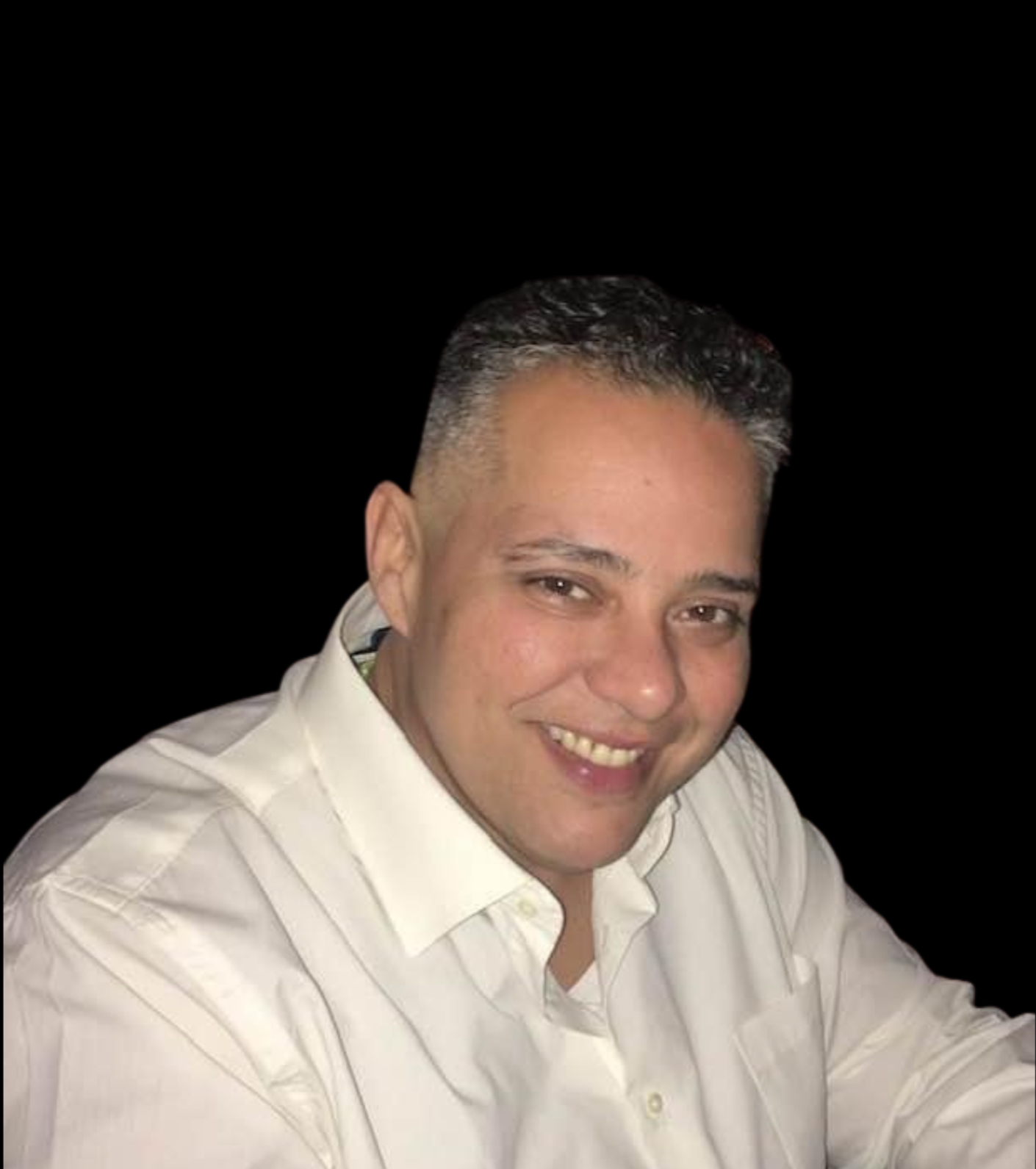 June owner of TaskPilot Virtual Services,  with short dark hair in a white shirt against a black background.