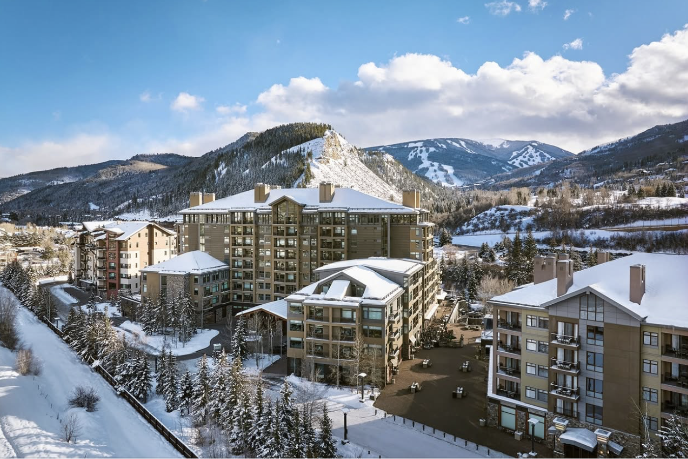 Snow-covered mountains and buildings in a winter landscape