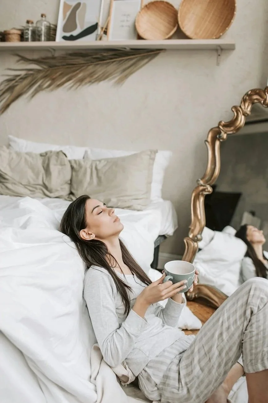 Woman feeling exhausted and relying on coffee for energy representing chronic fatigue support through functional nutrition at Paradigm Nutrition Bendigo