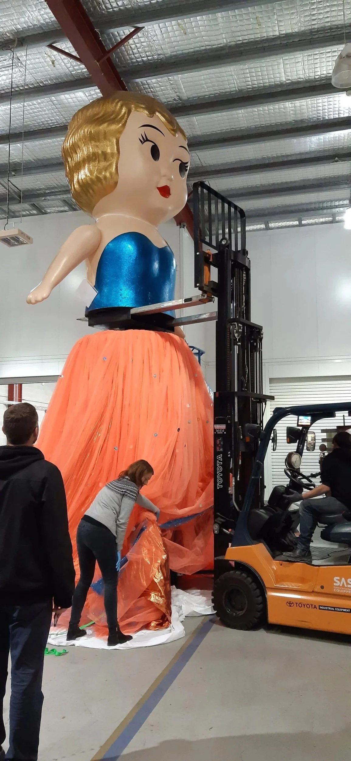 Textiles Technician - 2000 Olympics Kewpie Doll install