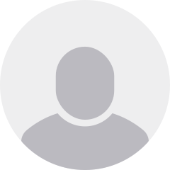 Placeholder silhouette icon of a person with a circular background.