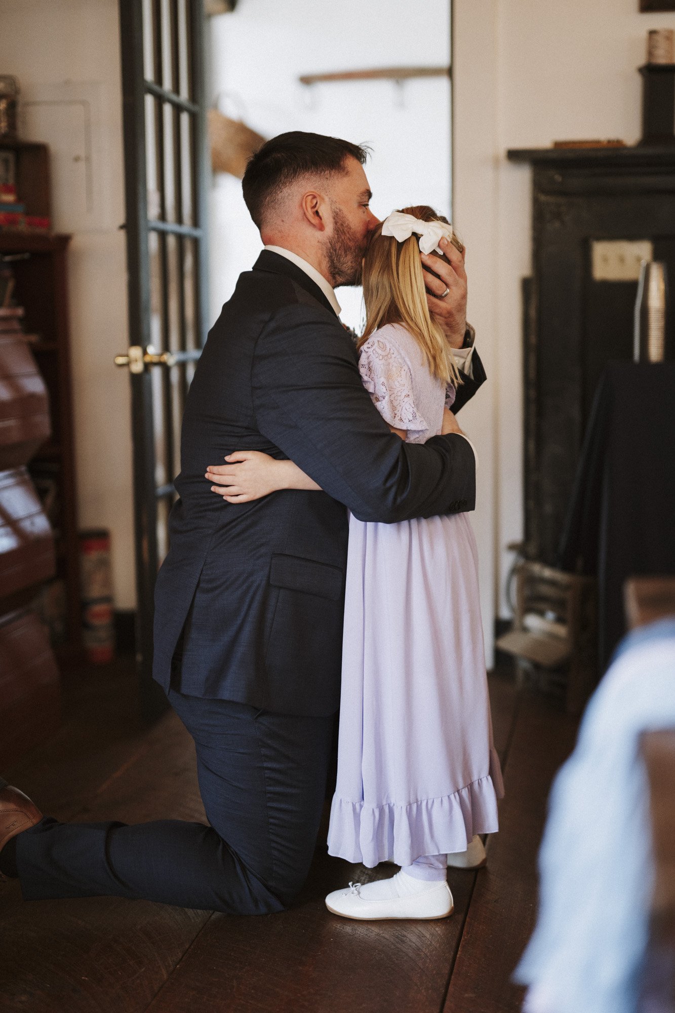 groom with daughter at wedding reception